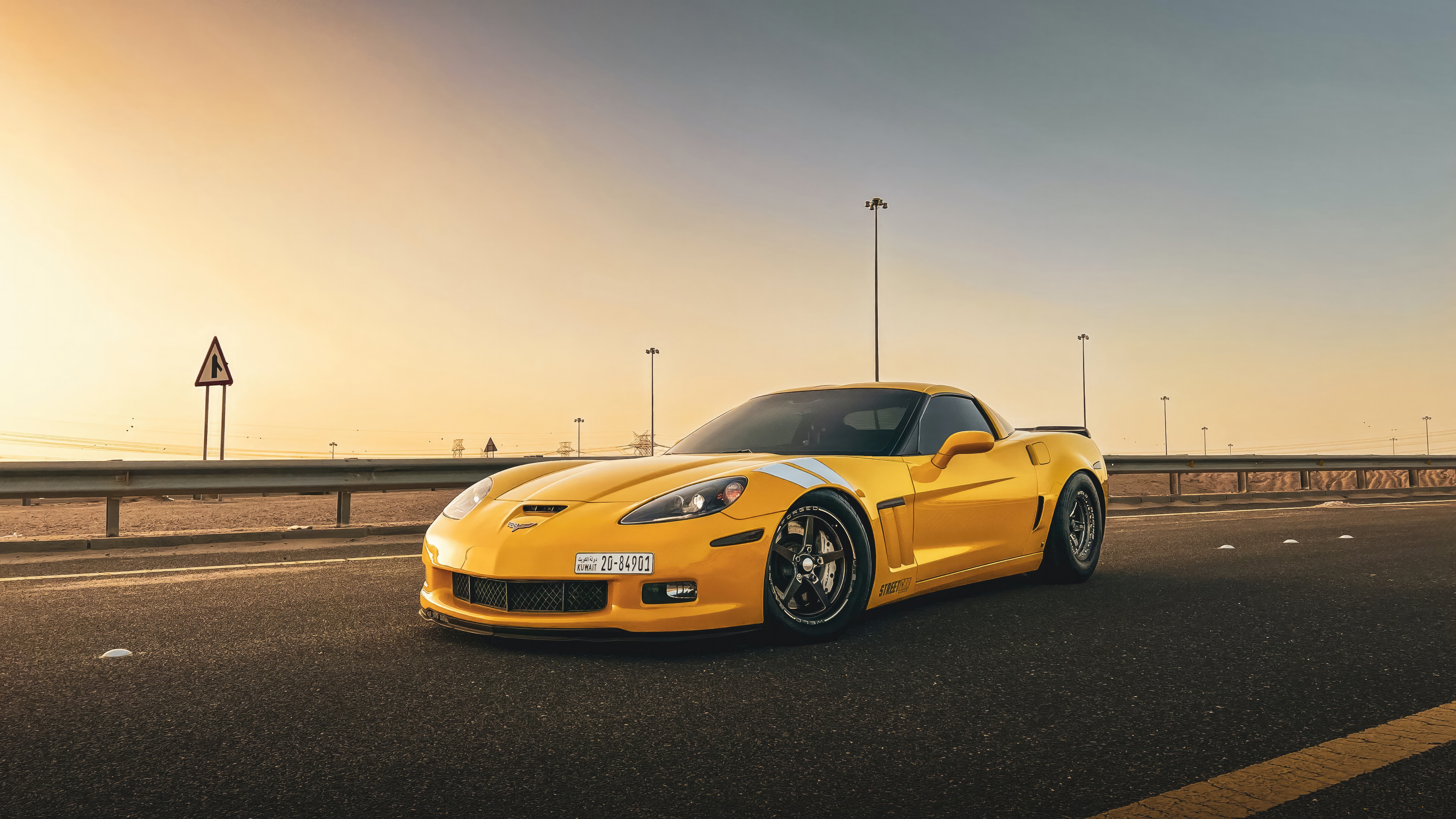 Yellow Corvette on a Road at Sunset HD Wallpaper
