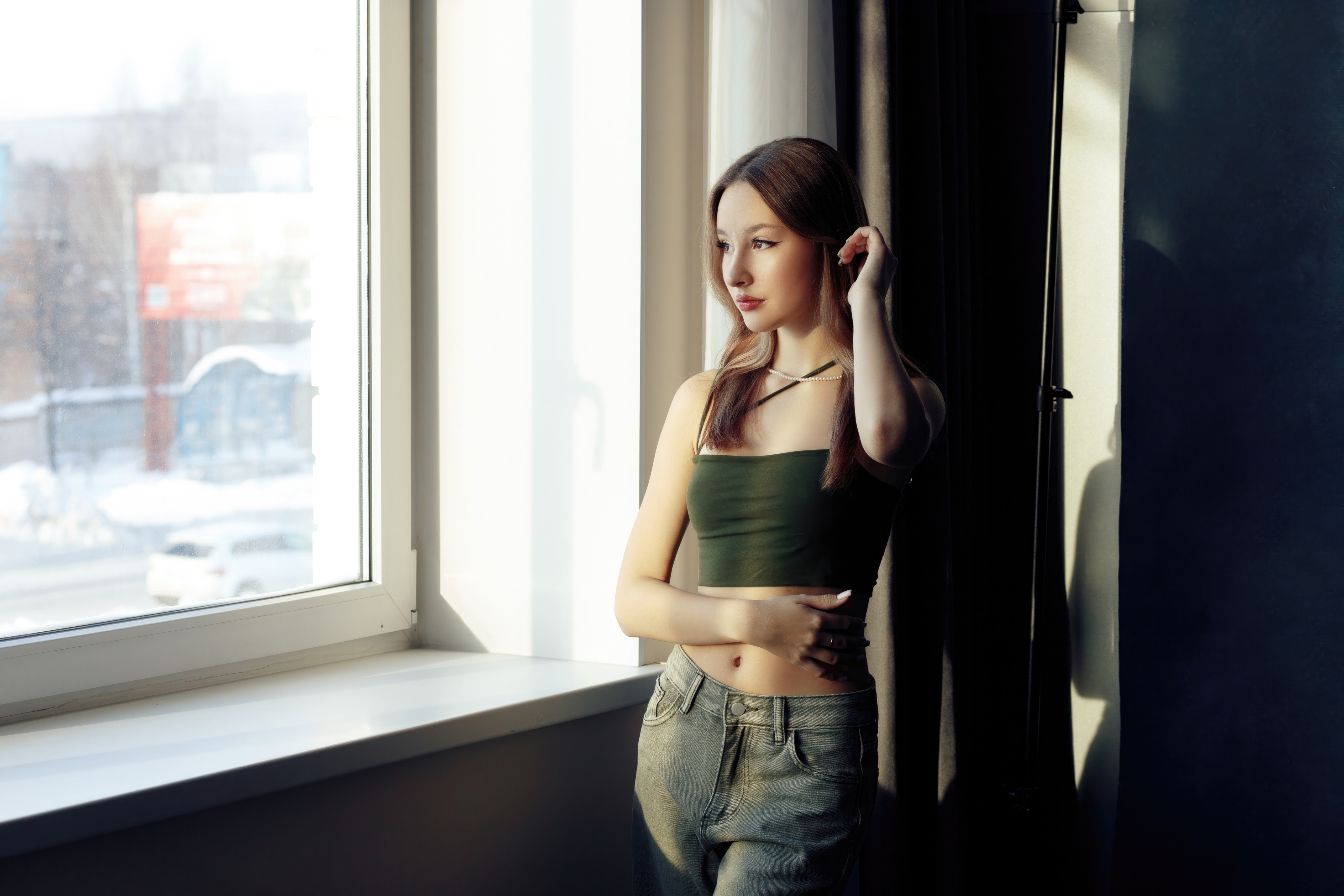 Girl in crop top and jeans by window HD Wallpaper