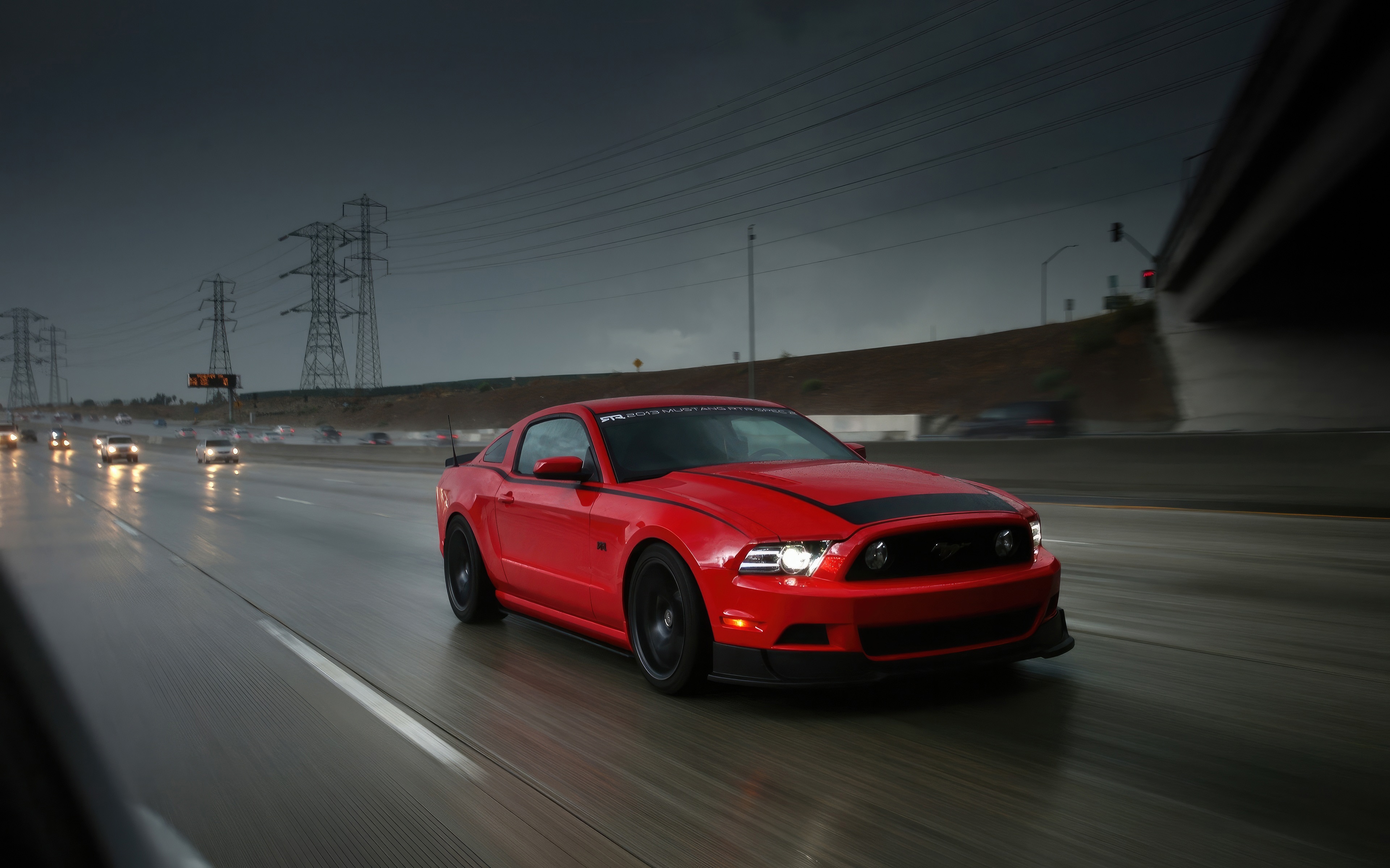Red Ford Mustang S197 driving on a wet highway HD Wallpaper
