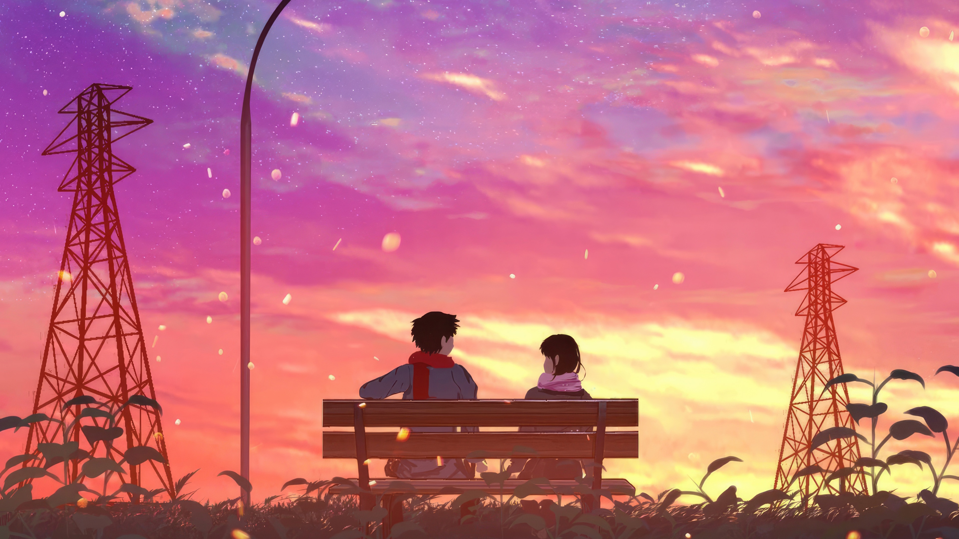 Couple sitting on a bench watching the sunset HD Wallpaper