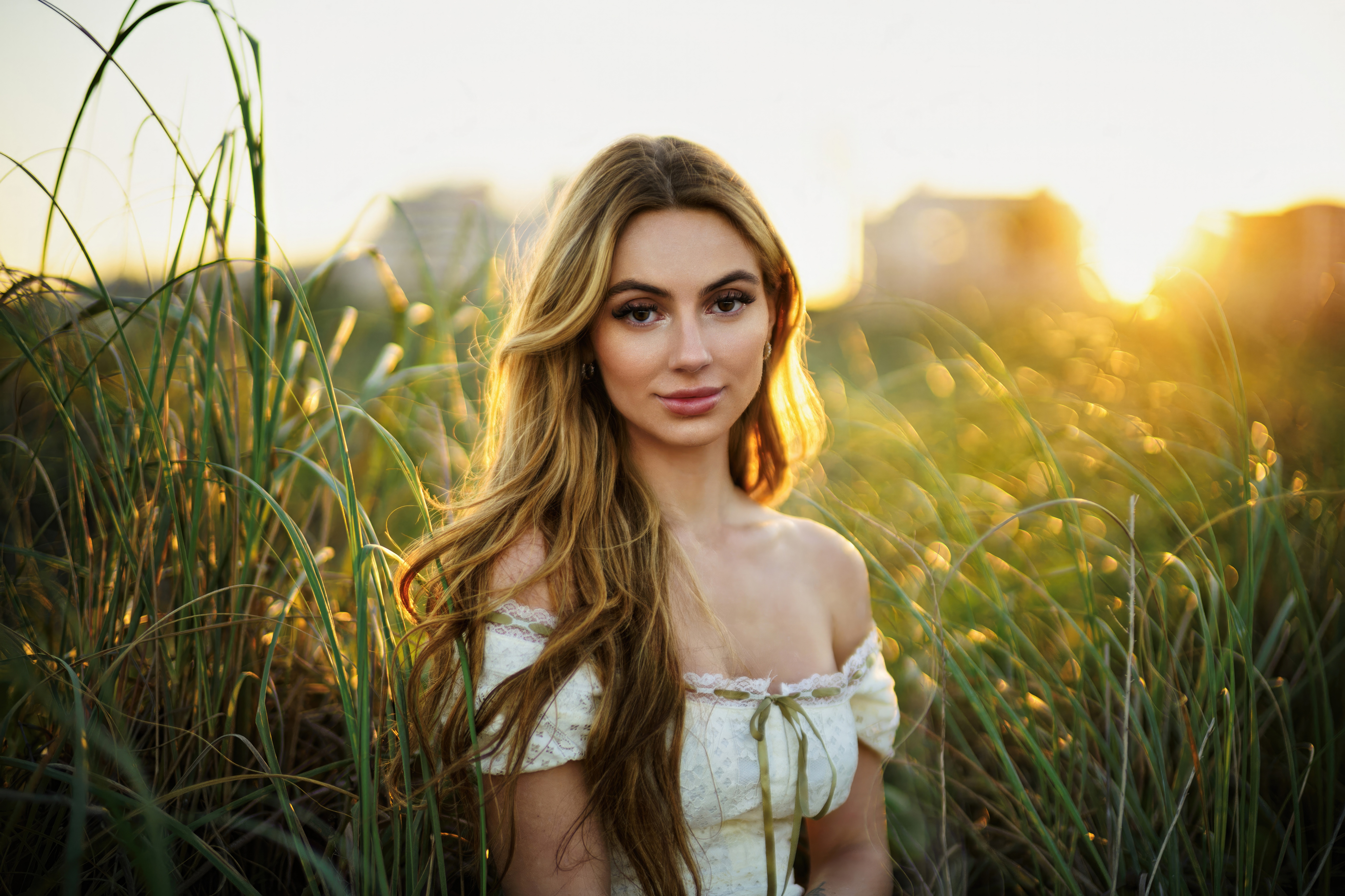 Girl in a field at sunset with bokeh HD Wallpaper