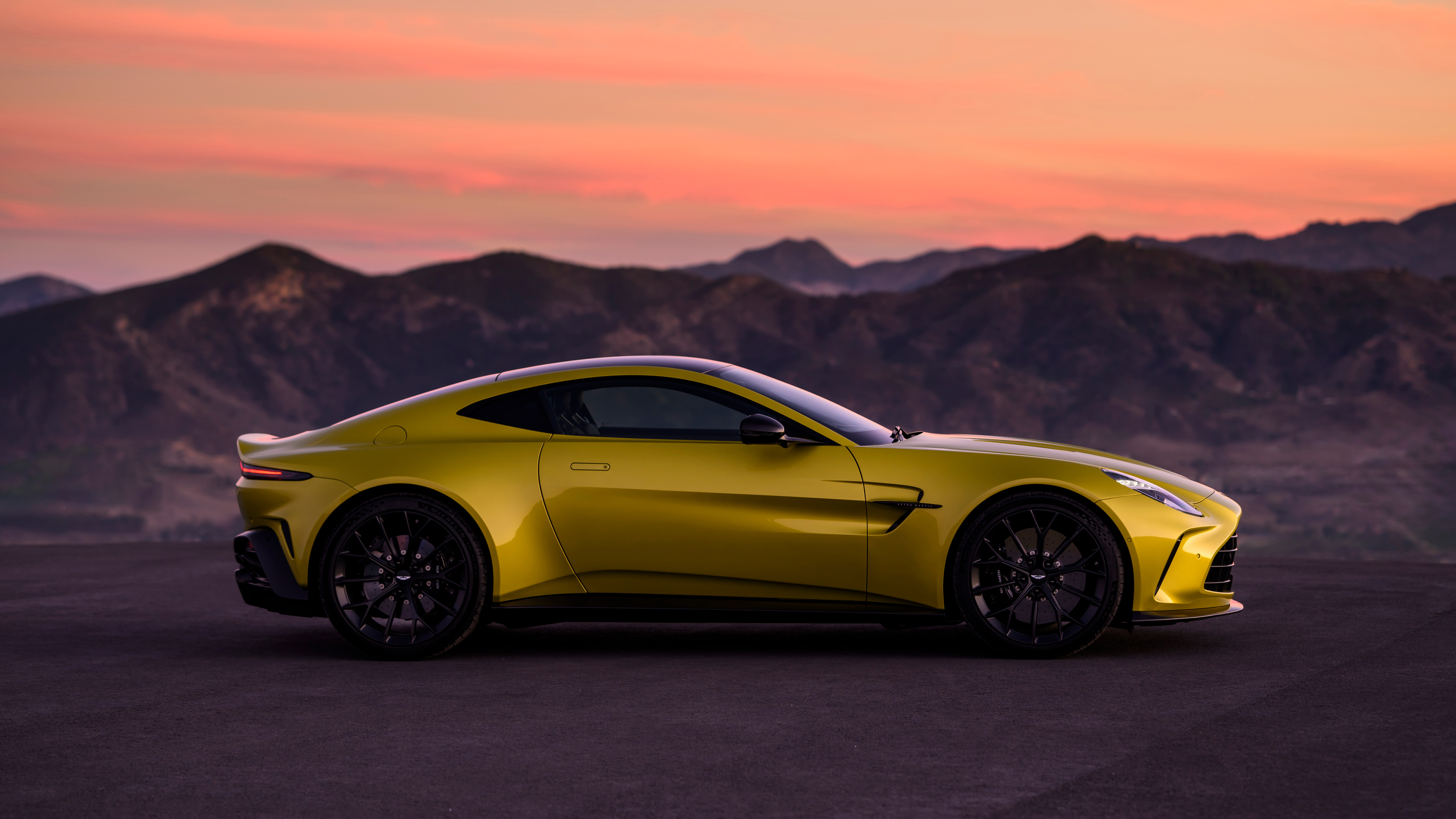 Yellow 2024 Aston Martin Vantage parked at sunset HD Wallpaper