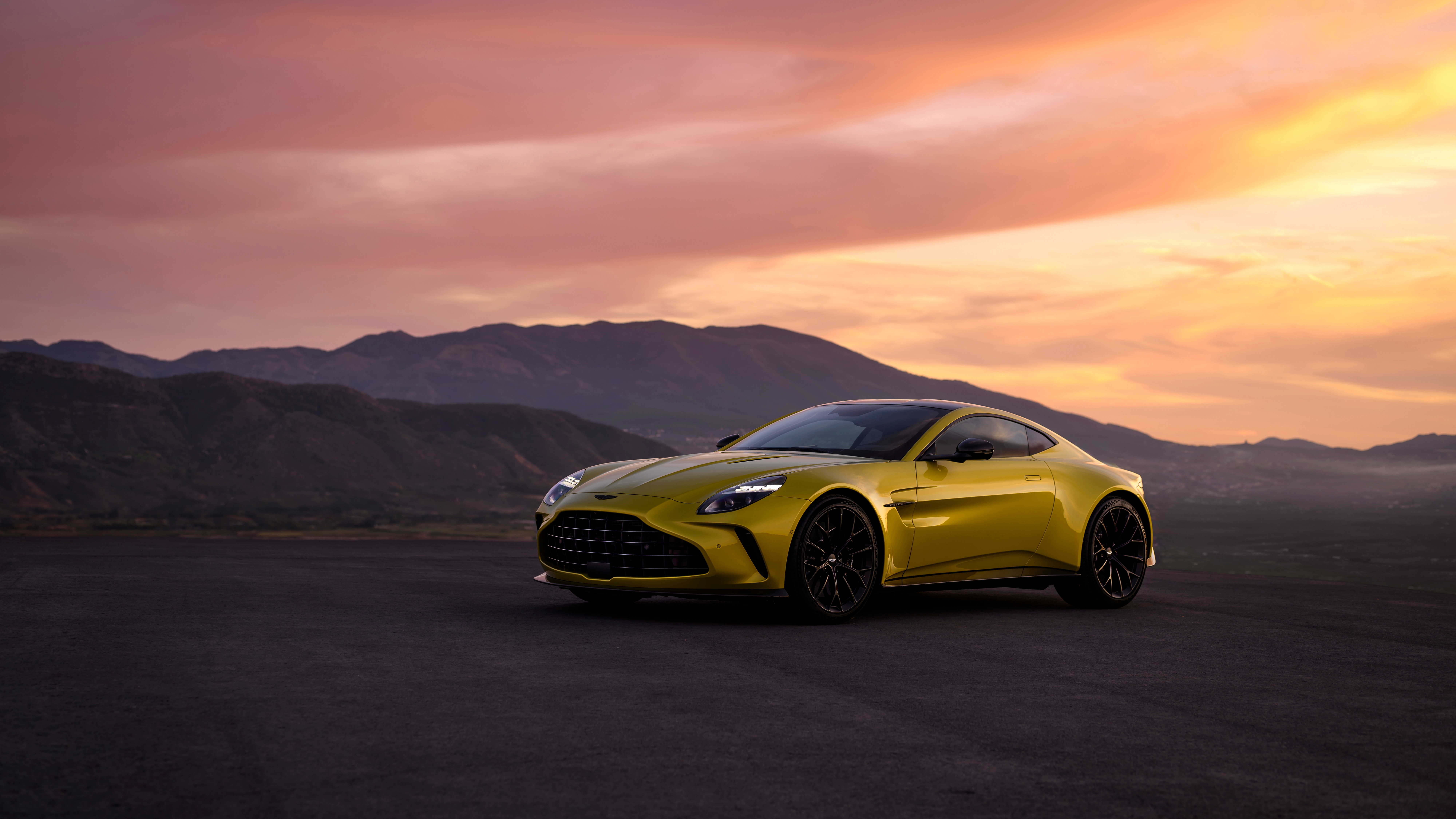 Yellow Aston Martin Vantage 2024 on a road at sunset HD Wallpaper