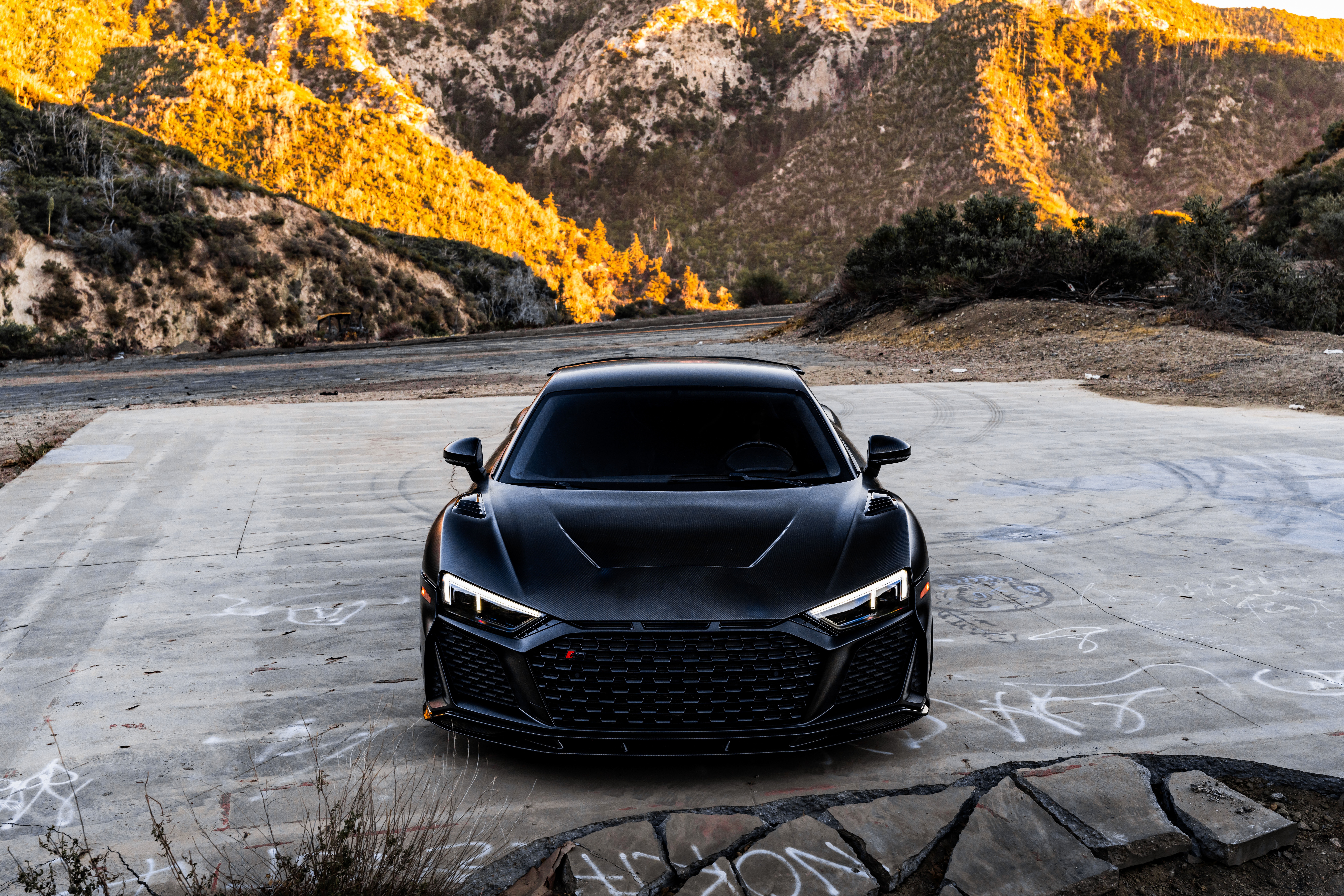 Black Audi R8 V10 on a concrete surface HD Wallpaper