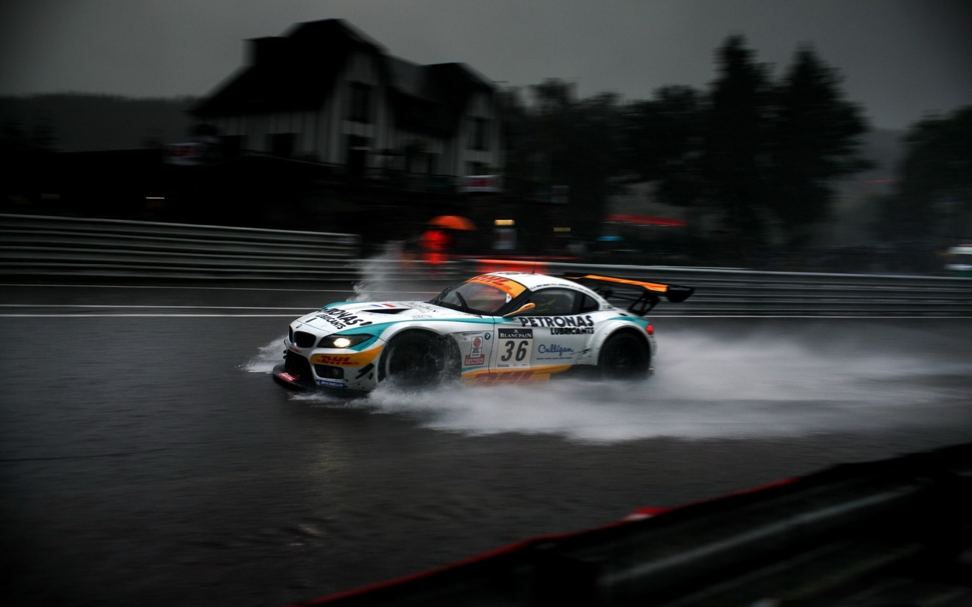 BMW Z4 GT3 racing car on a wet track HD Wallpaper