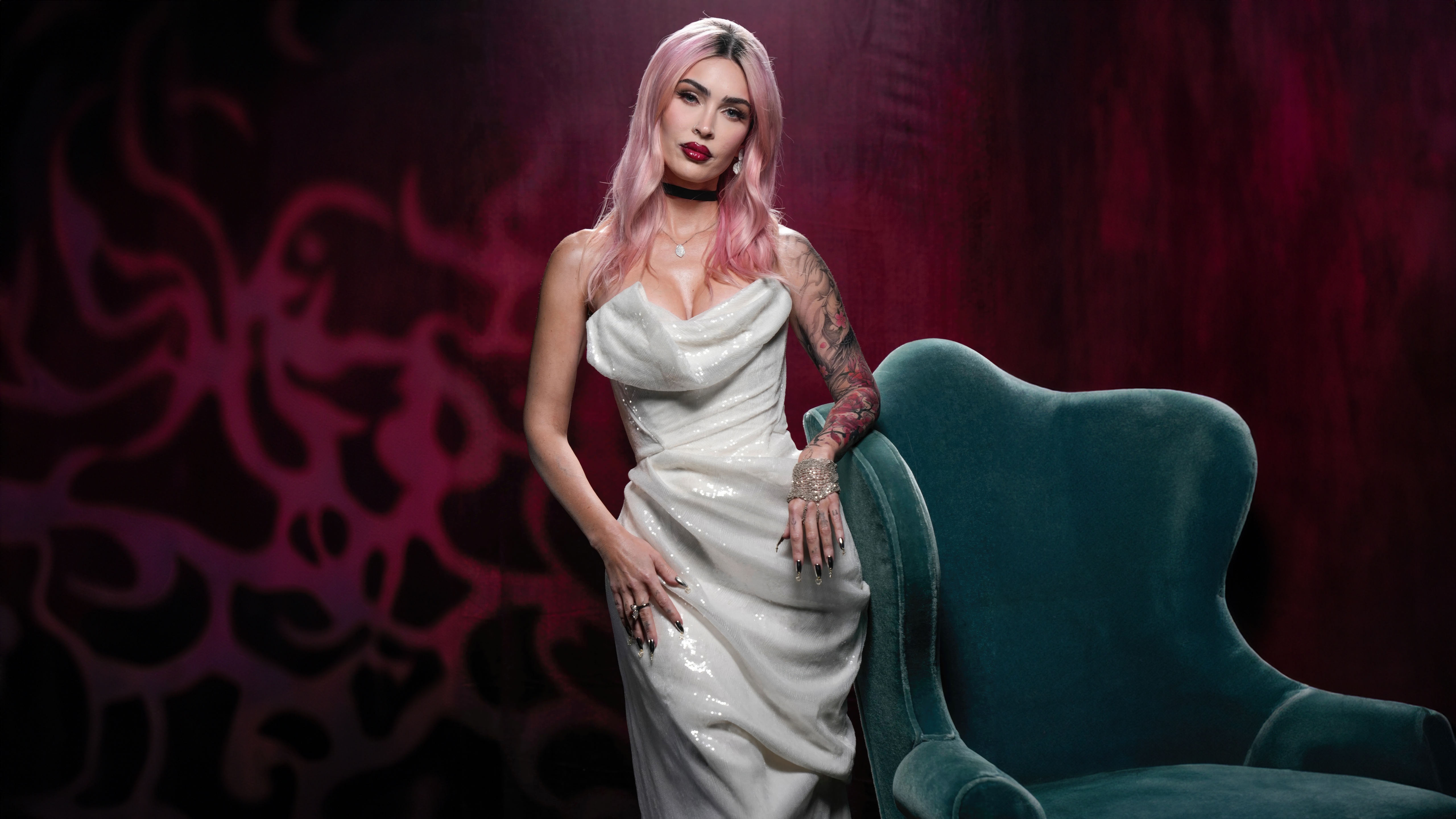 Megan Fox in a white dress leaning on a chair HD Wallpaper