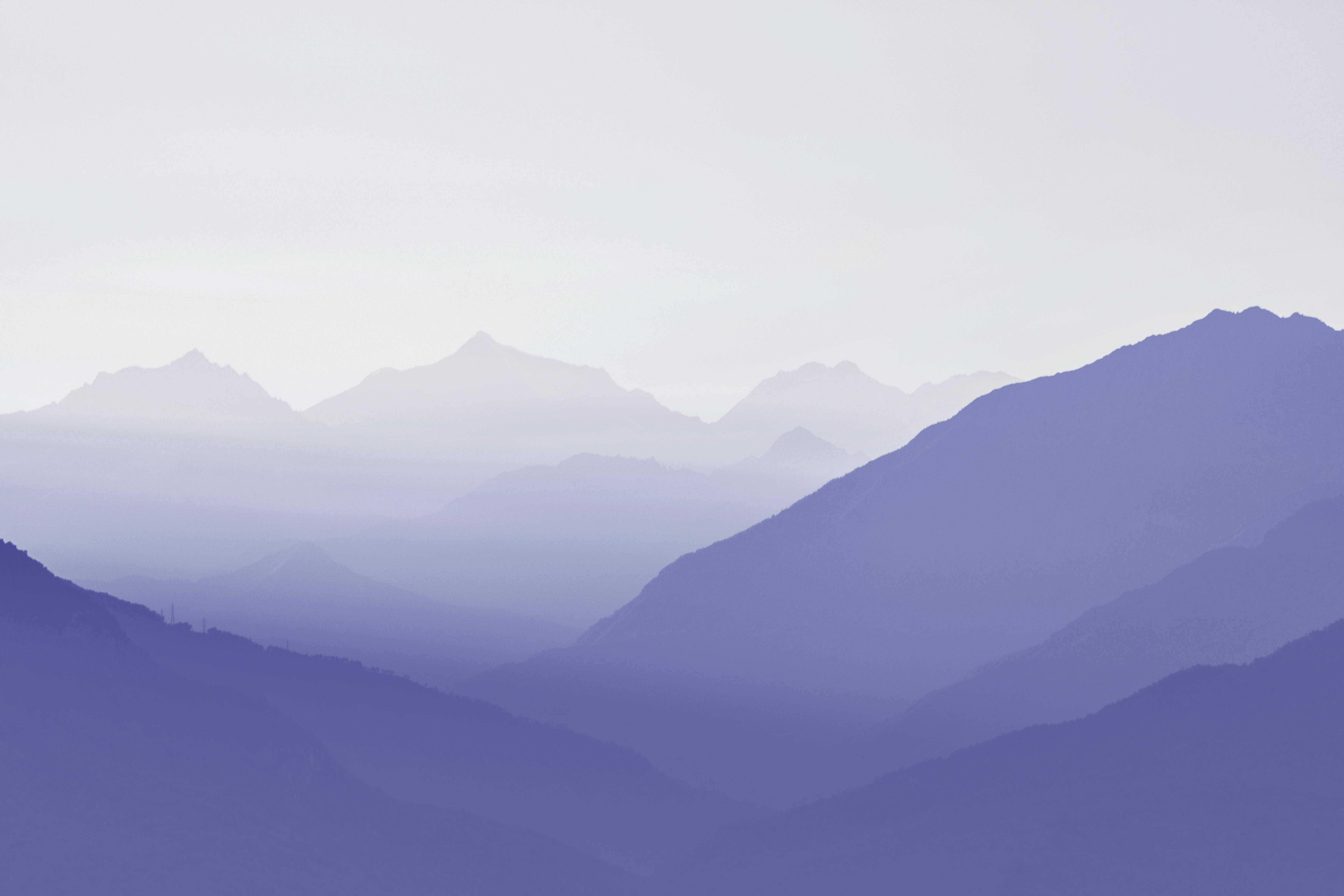Purple Hues of Distant Mountains in Fog HD Wallpaper