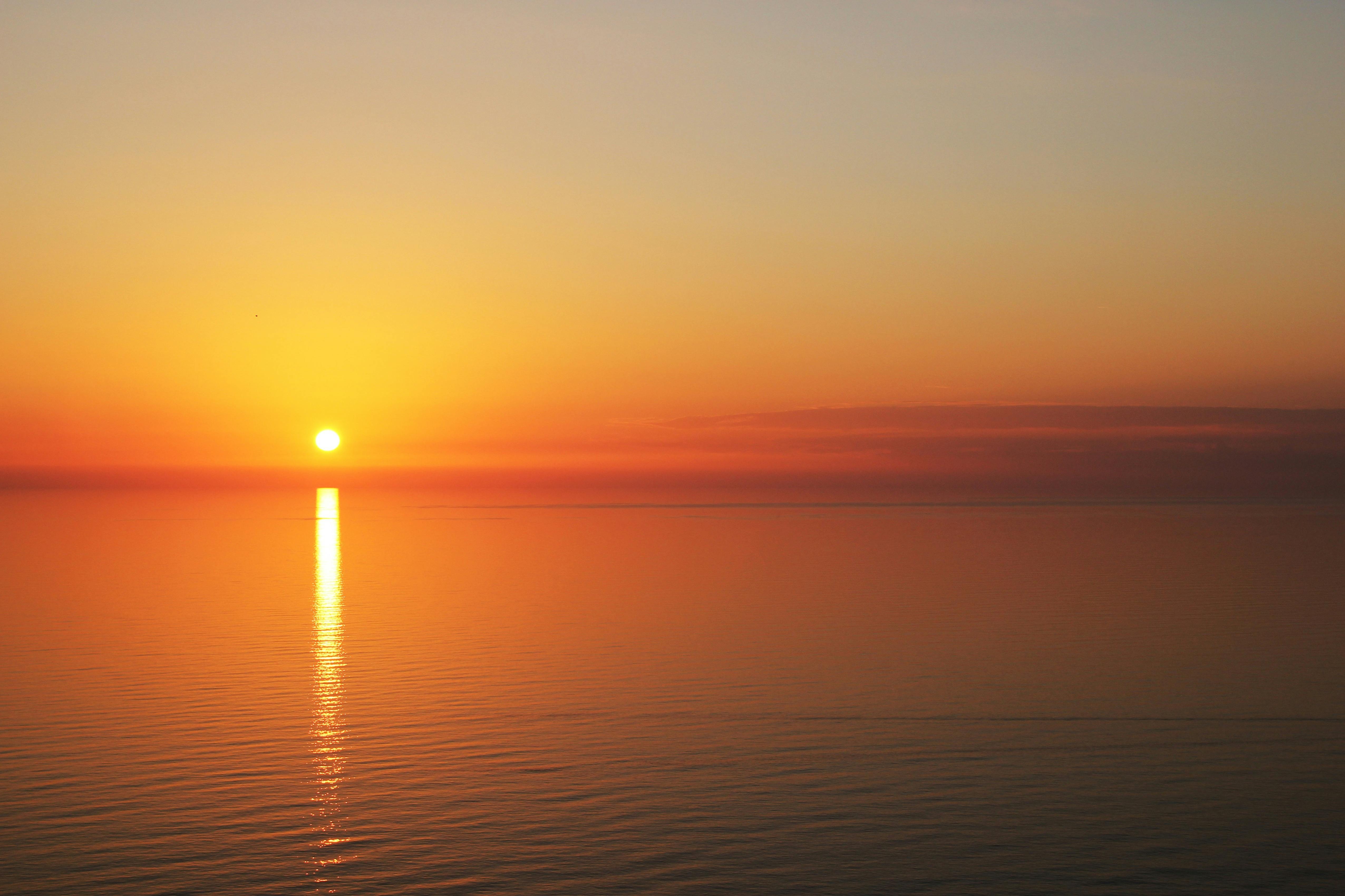 Calm Body Of Water During Sunset HD Wallpaper