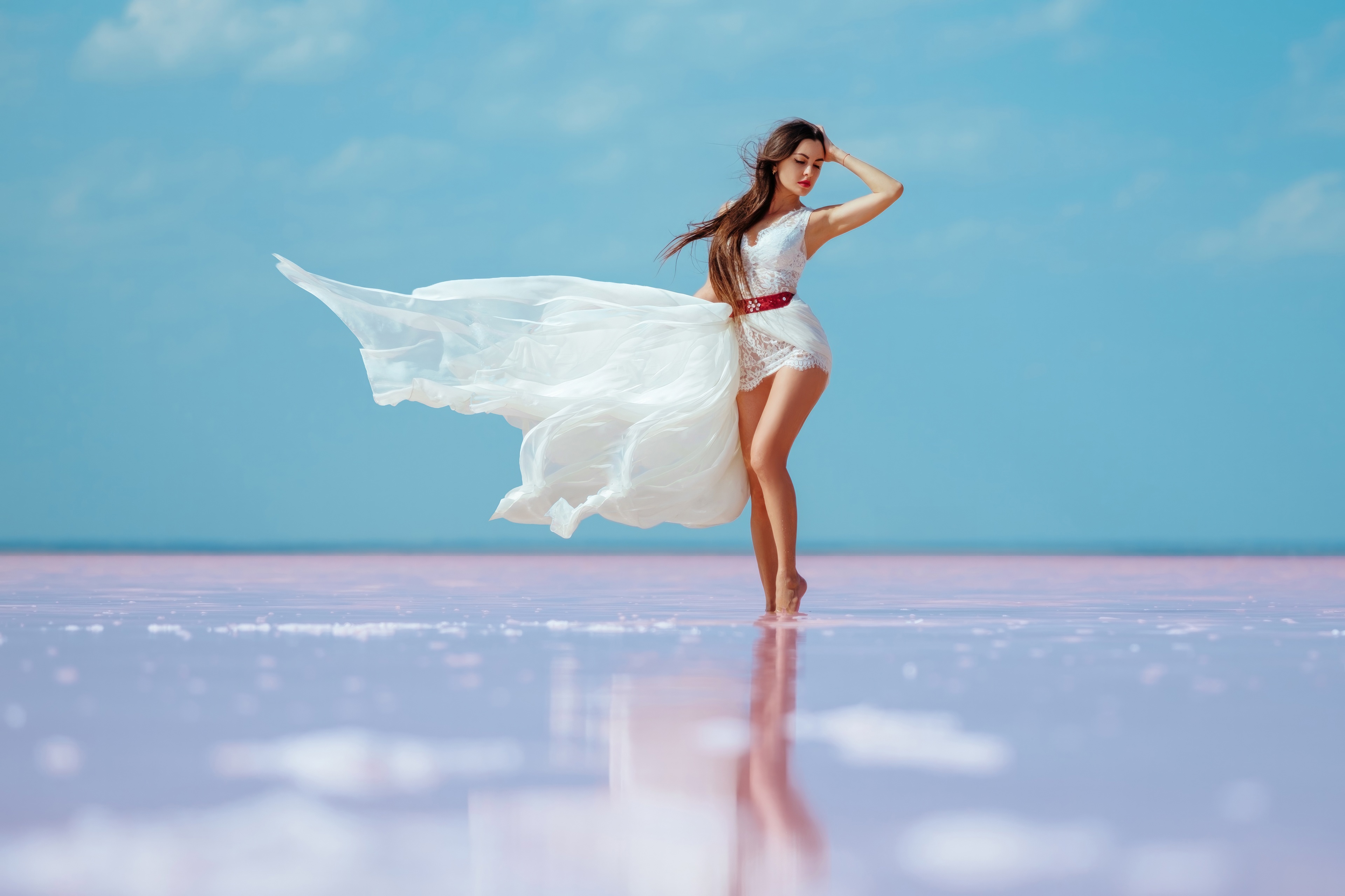 Woman in white dress on pink salt lake HD Wallpaper