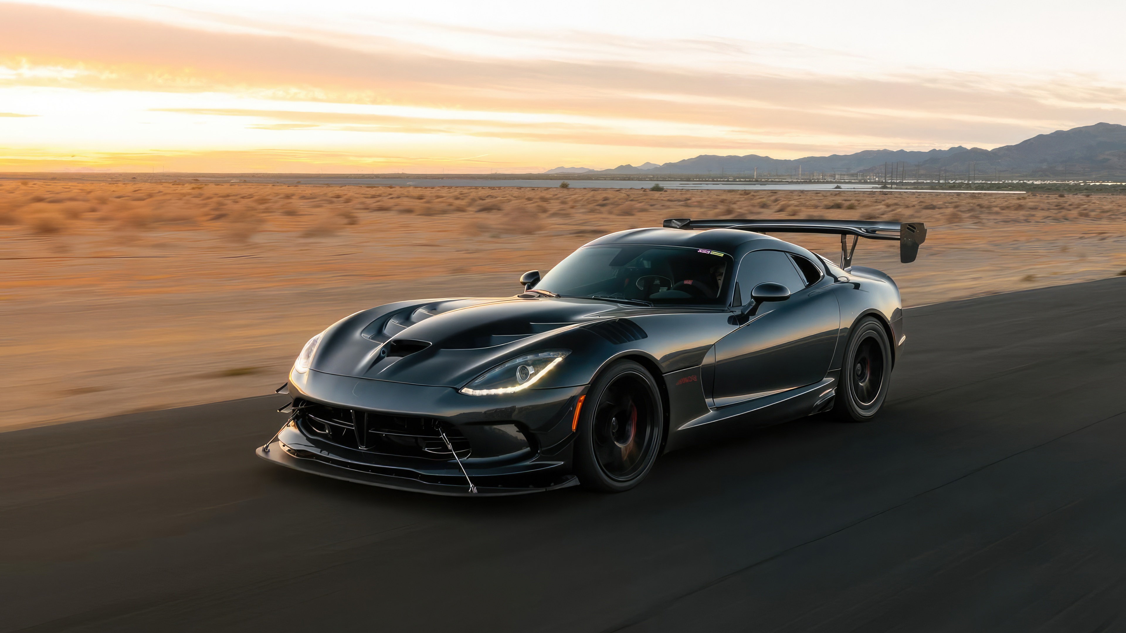 Black Dodge Viper driving on a desert road HD Wallpaper