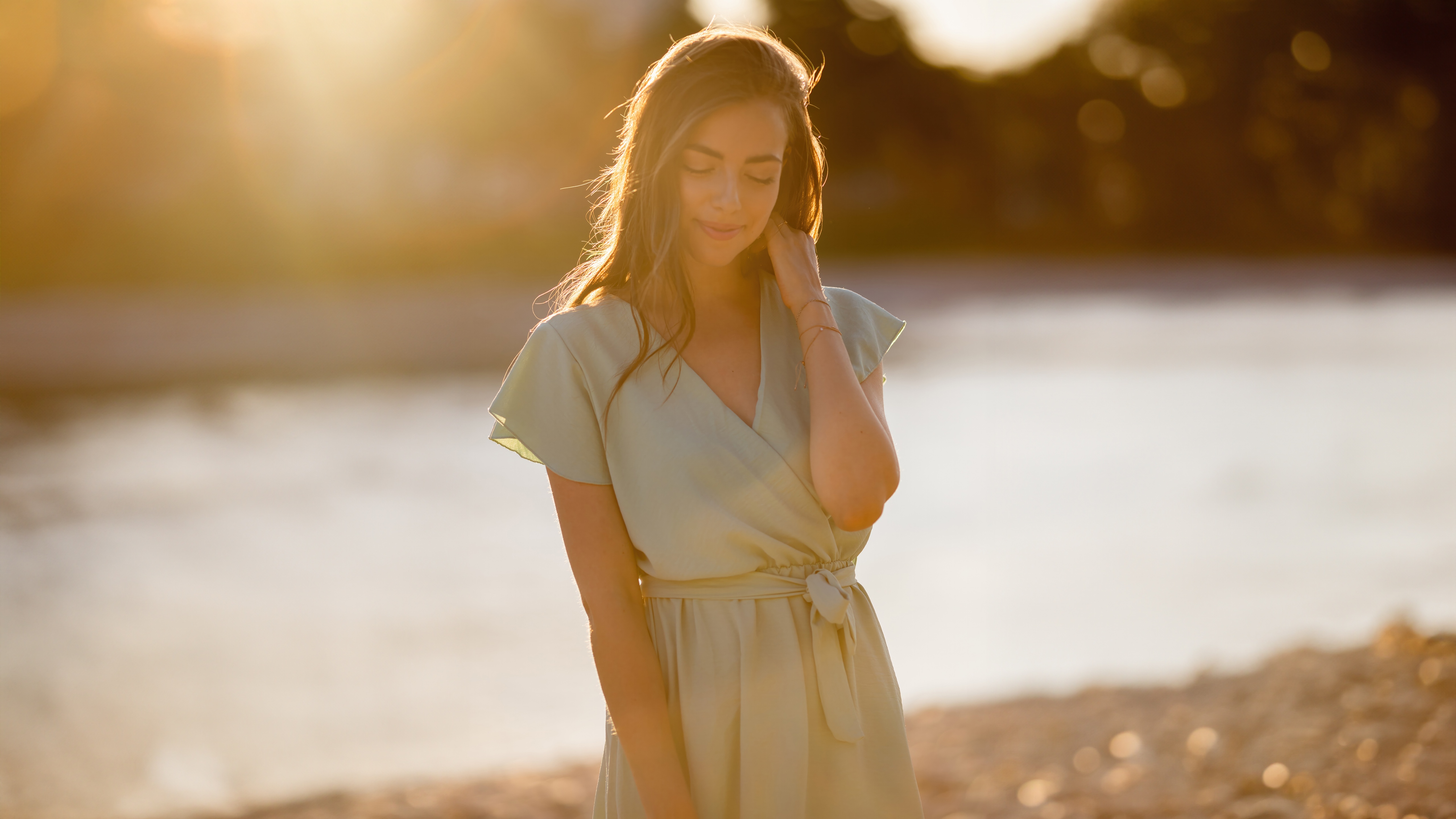 Woman in a light green dress by the water HD Wallpaper