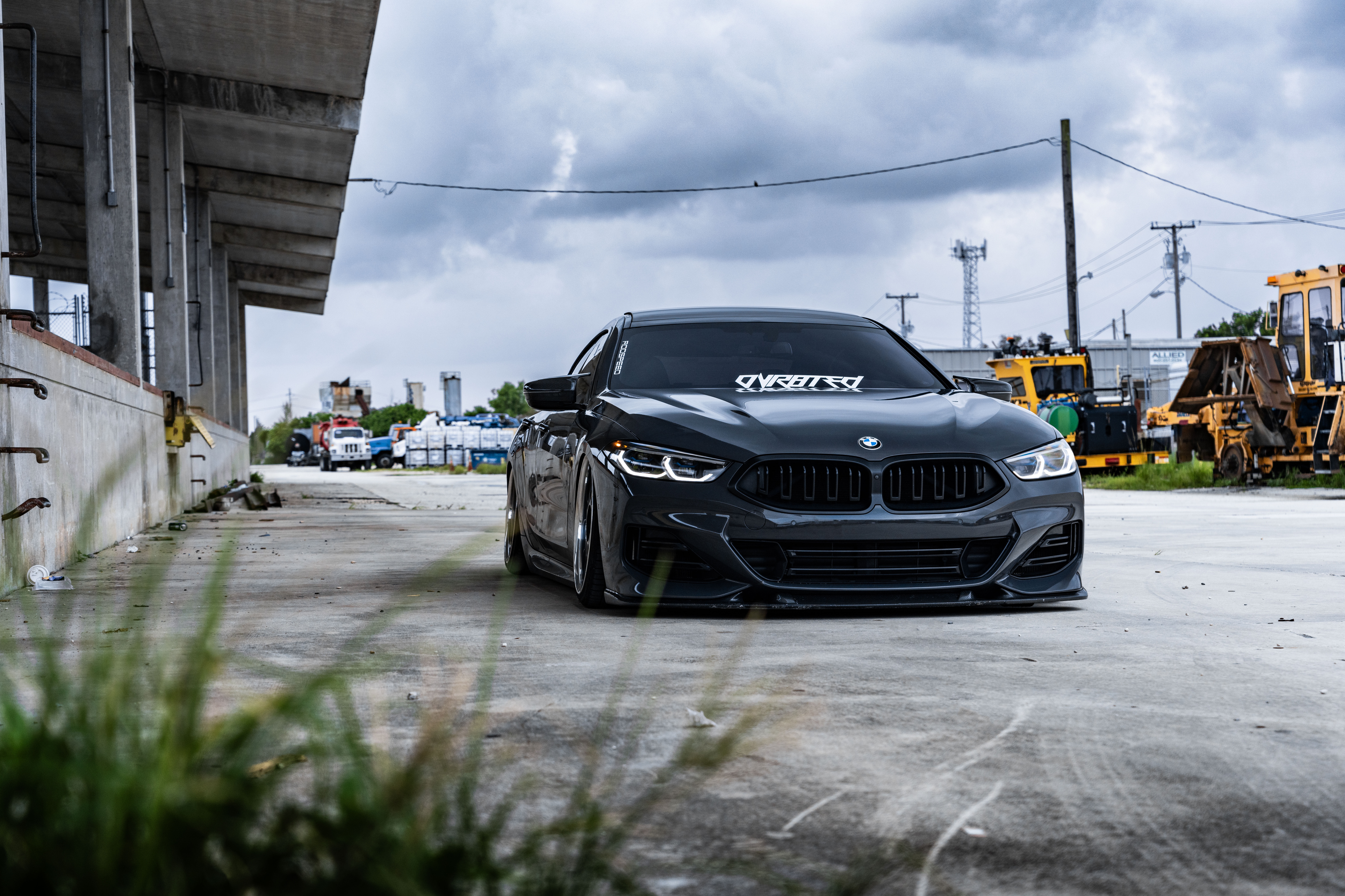 Dark BMW 8 Series 850i parked outdoors HD Wallpaper
