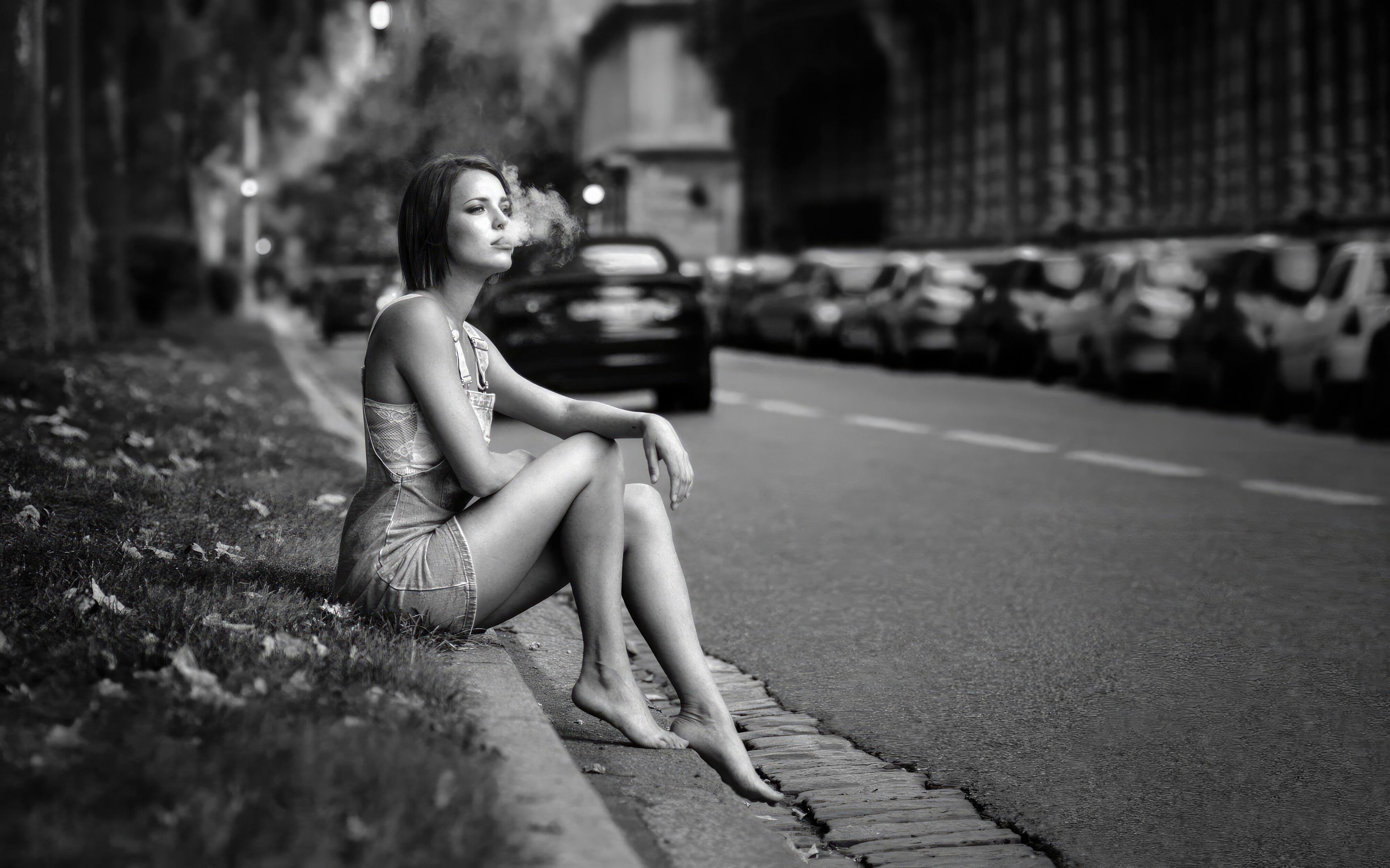 Girl sitting on curb smoking cigarette HD Wallpaper