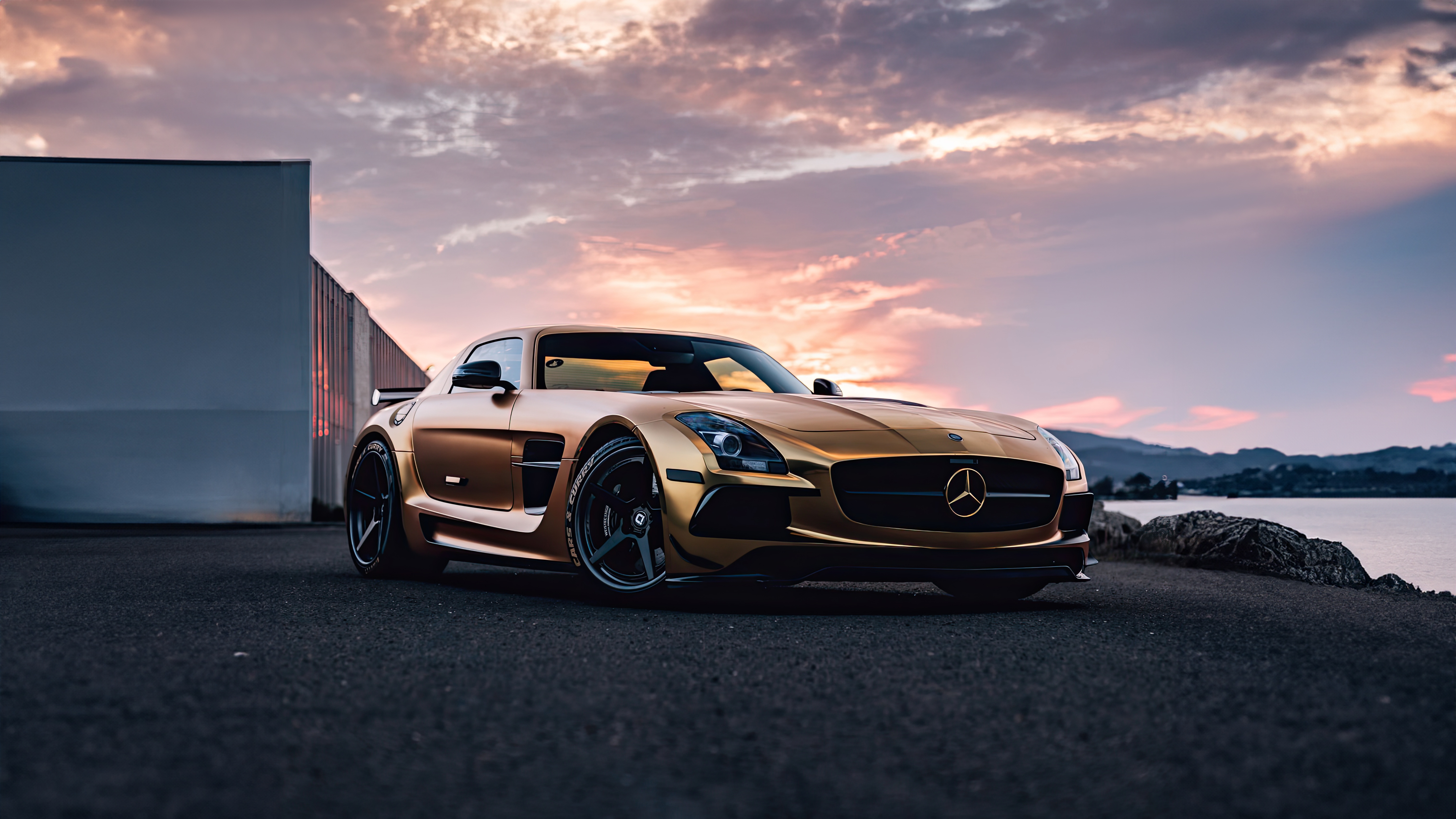 Gold Mercedes-Benz SLS AMG parked by the water HD Wallpaper