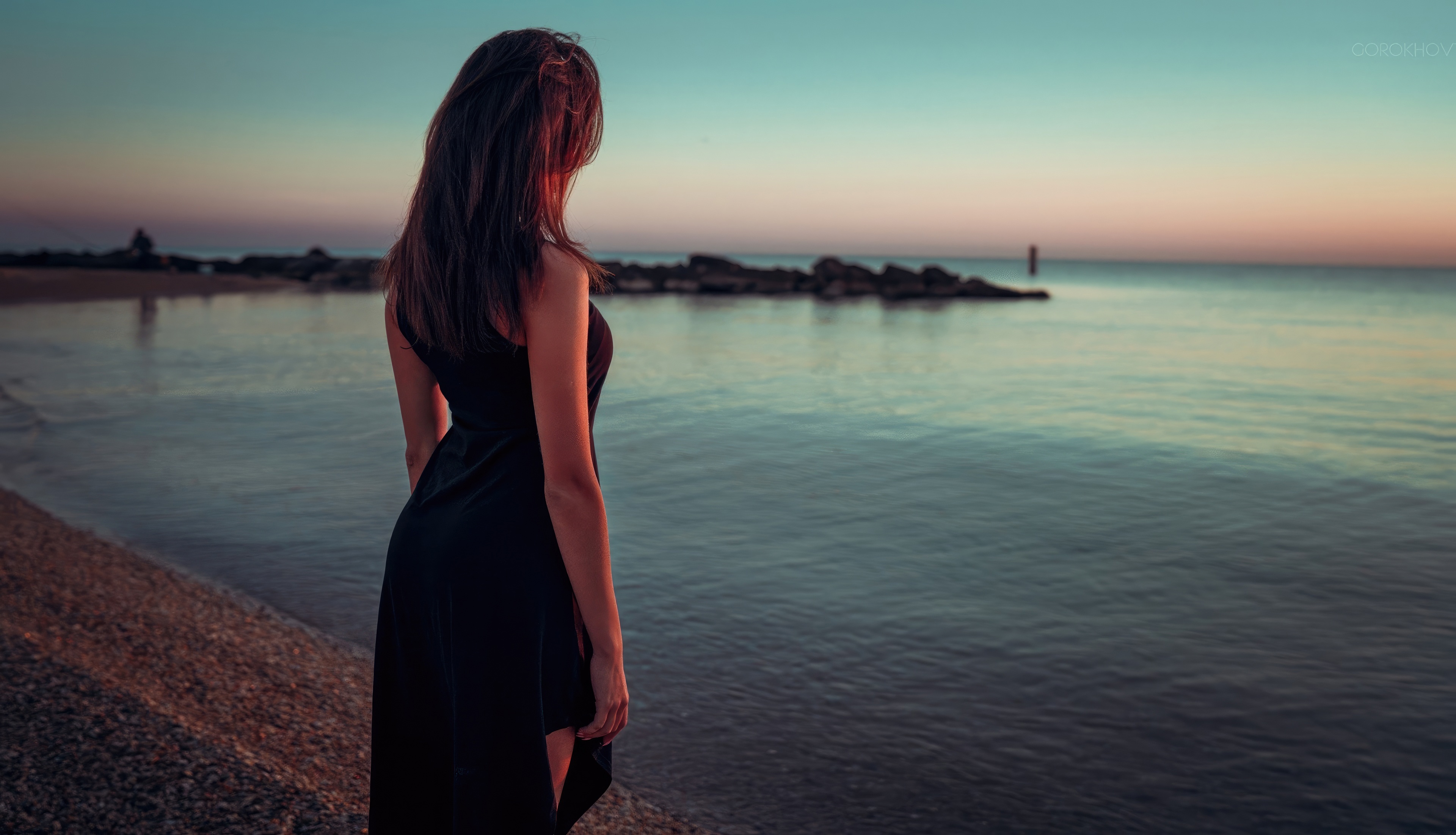 Girl in black dress by the sea at sunset HD Wallpaper