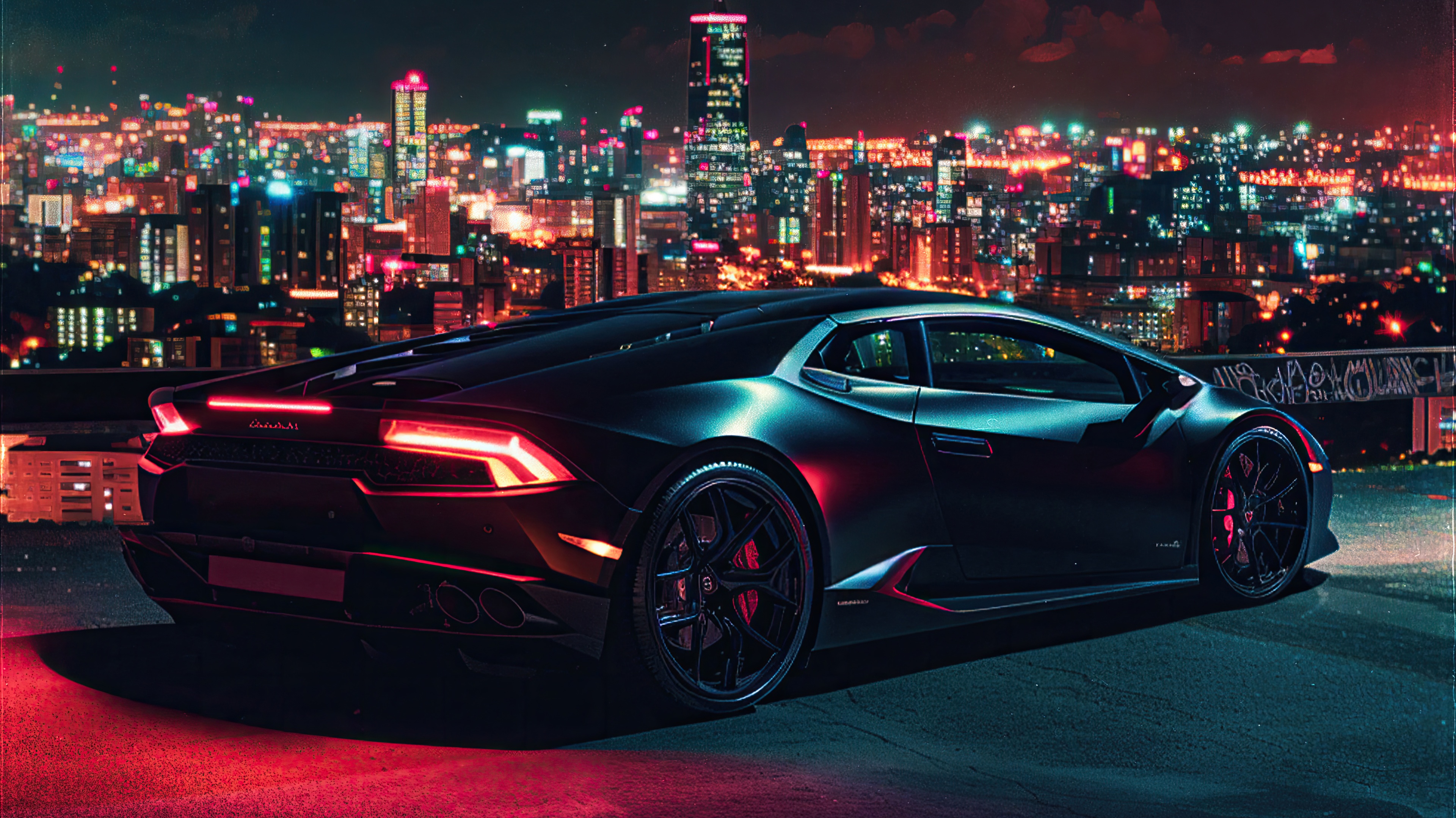 Black Lamborghini Huracan parked against a city skyline at night HD Wallpaper
