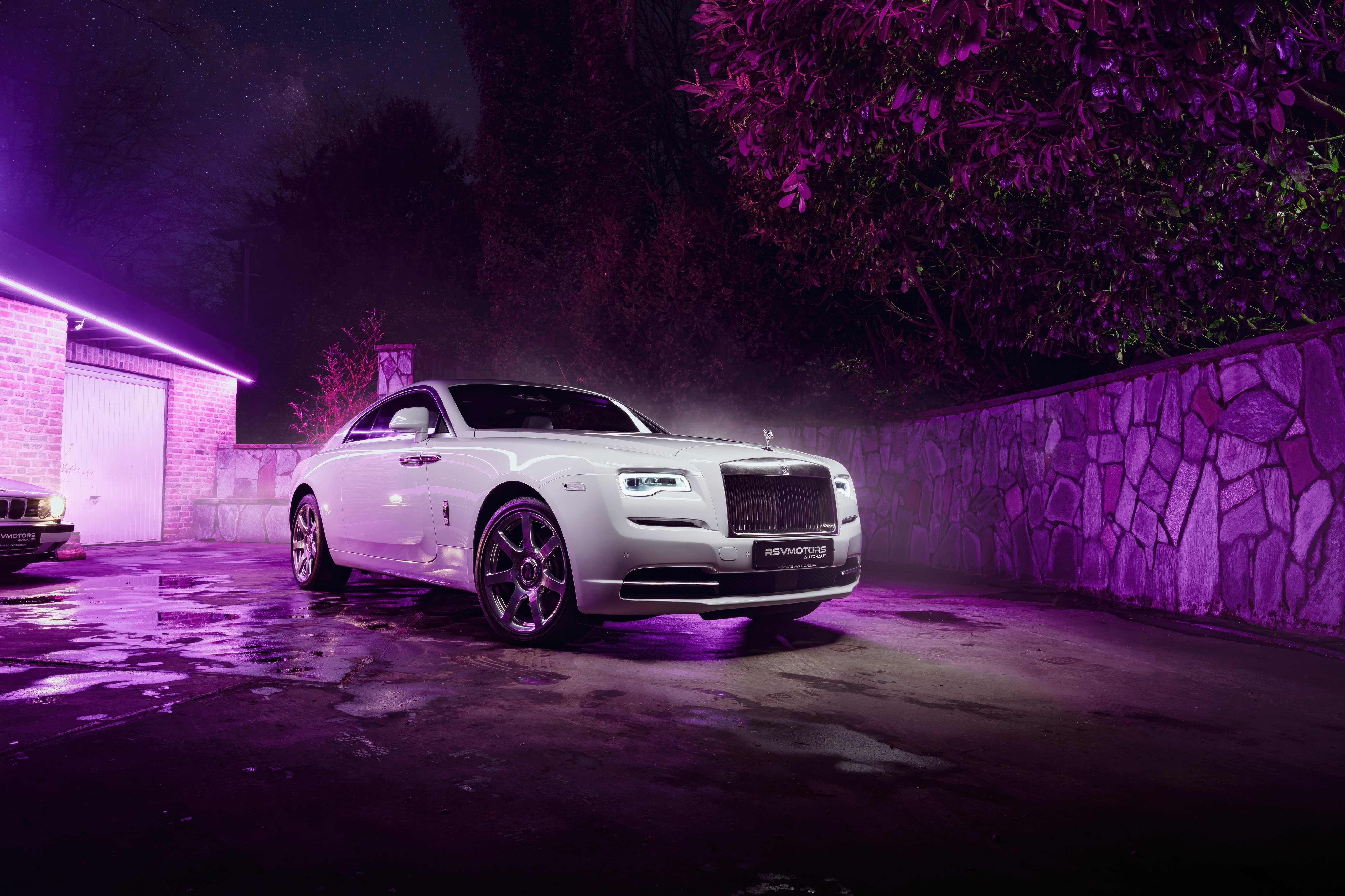 White Rolls Royce Wraith parked at night with purple lighting HD Wallpaper