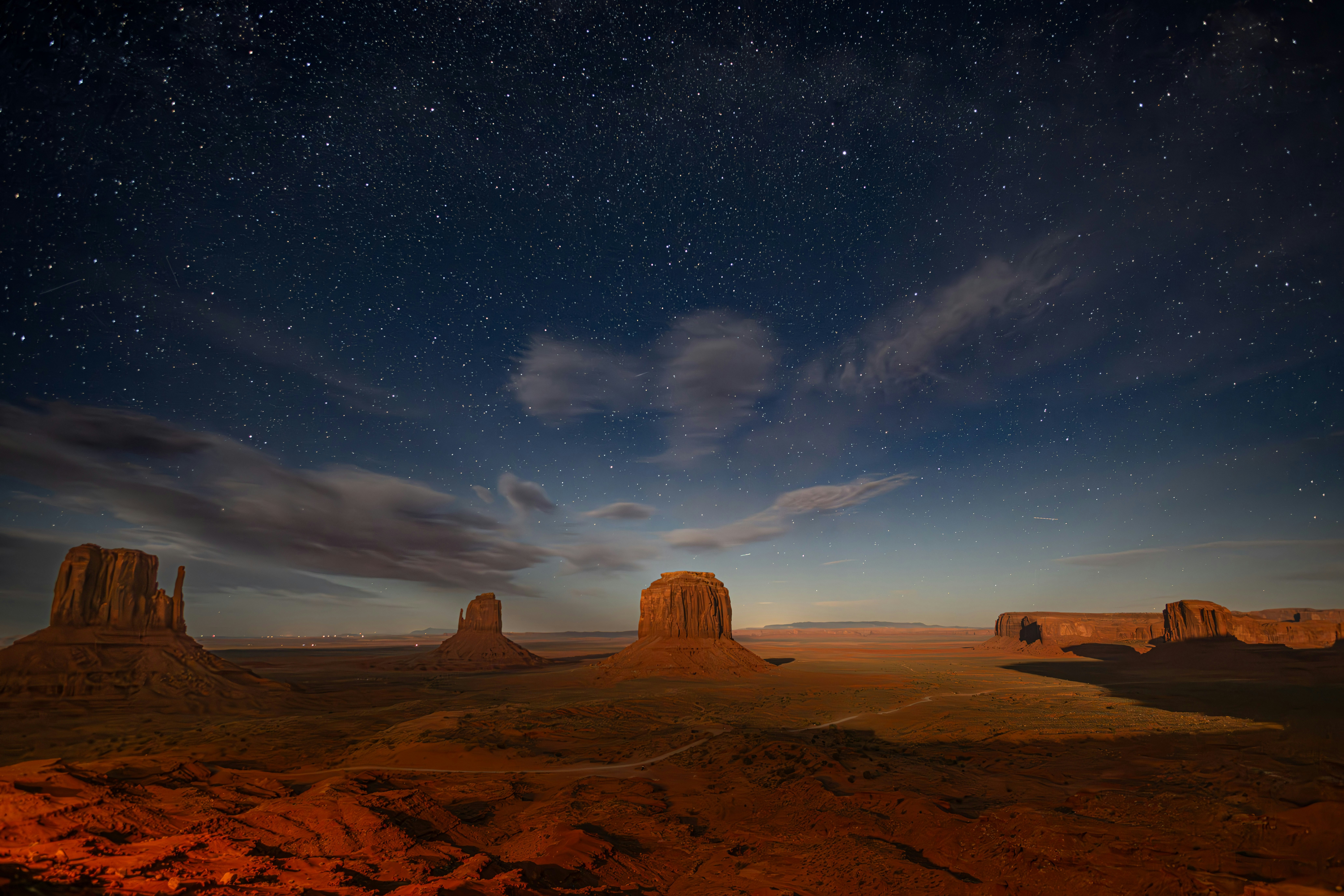 Monument Valley Under a Starry Night Sky HD Wallpaper