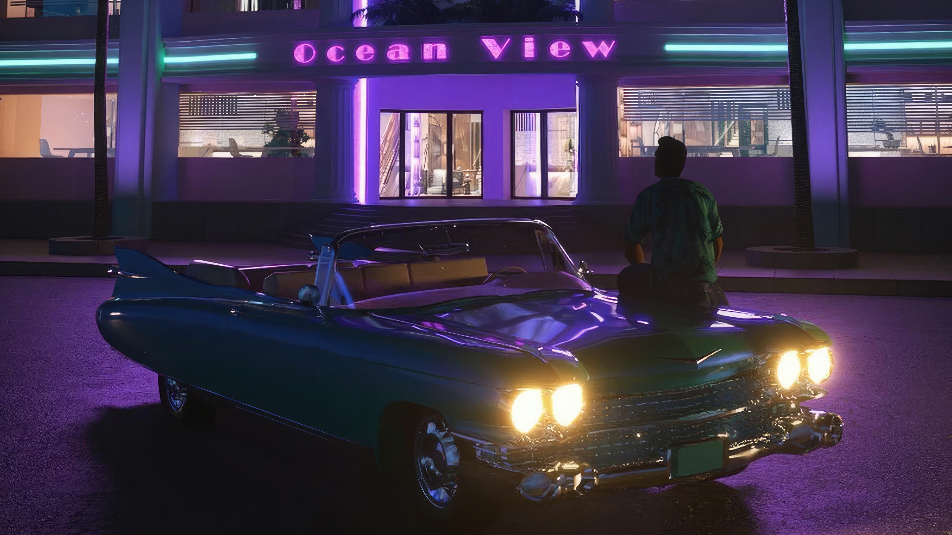 Tommy Vercetti sits on a convertible in front of Ocean View HD Wallpaper