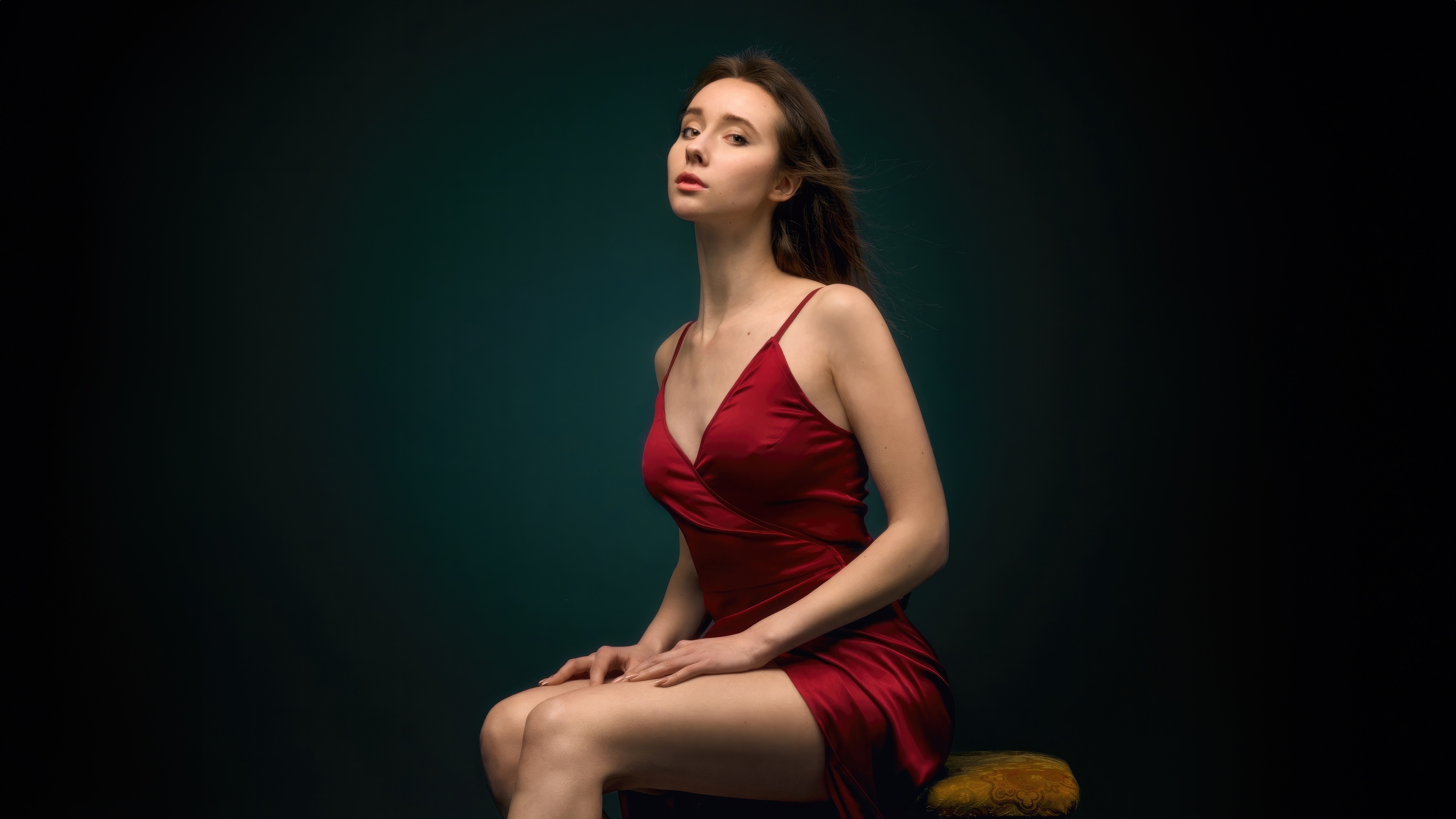 Woman in a red dress sitting on a stool HD Wallpaper