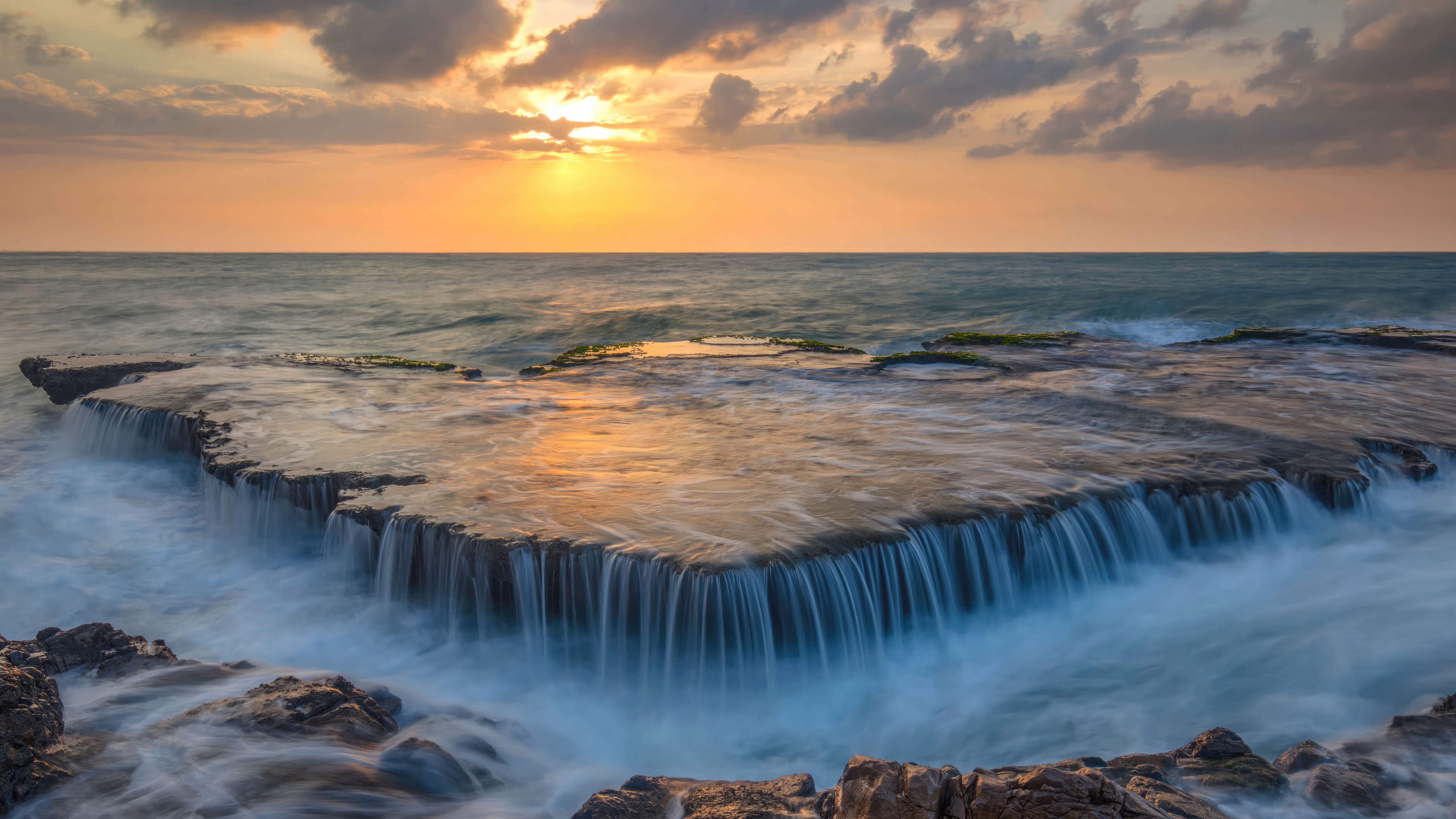Water Cascades Over An Ancient Coral Reef at Sunset HD Wallpaper
