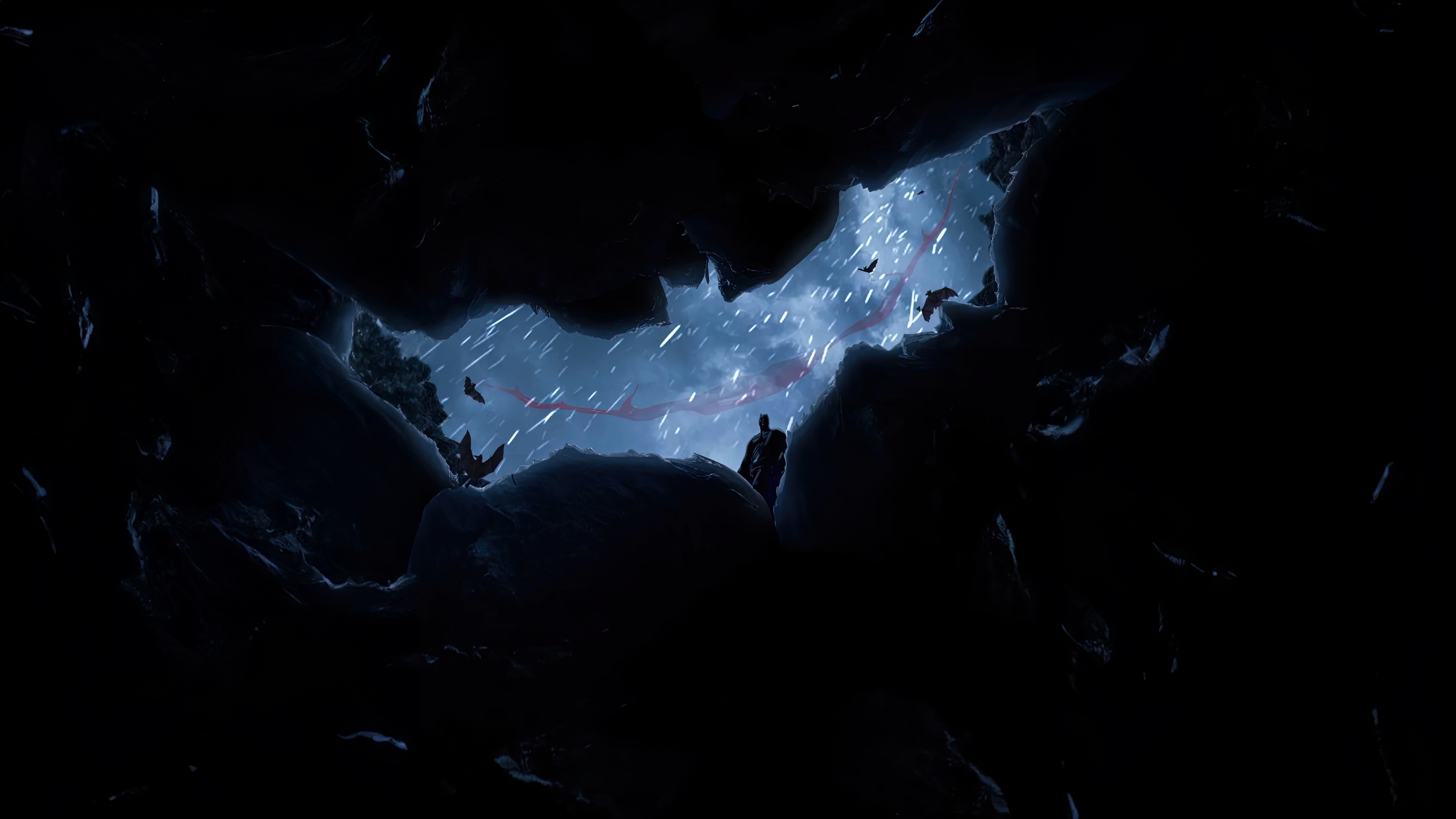 Batman in a cave during a storm HD Wallpaper