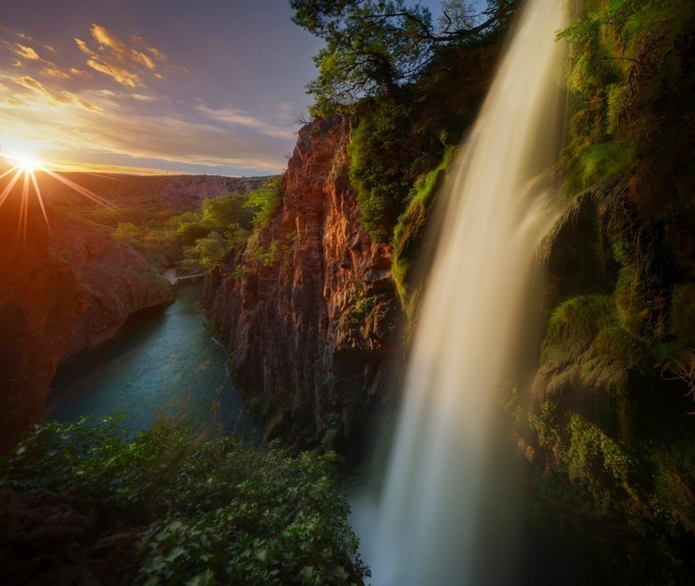 Sunrise over a waterfall and river canyon HD Wallpaper