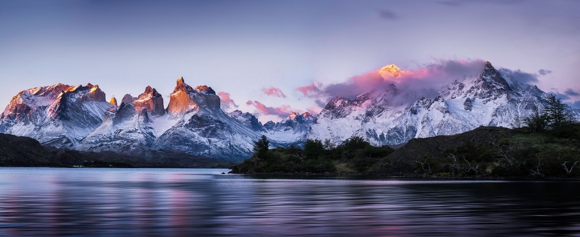 Torres del Paine mountains at sunrise over a lake in Patagonia HD Wallpaper