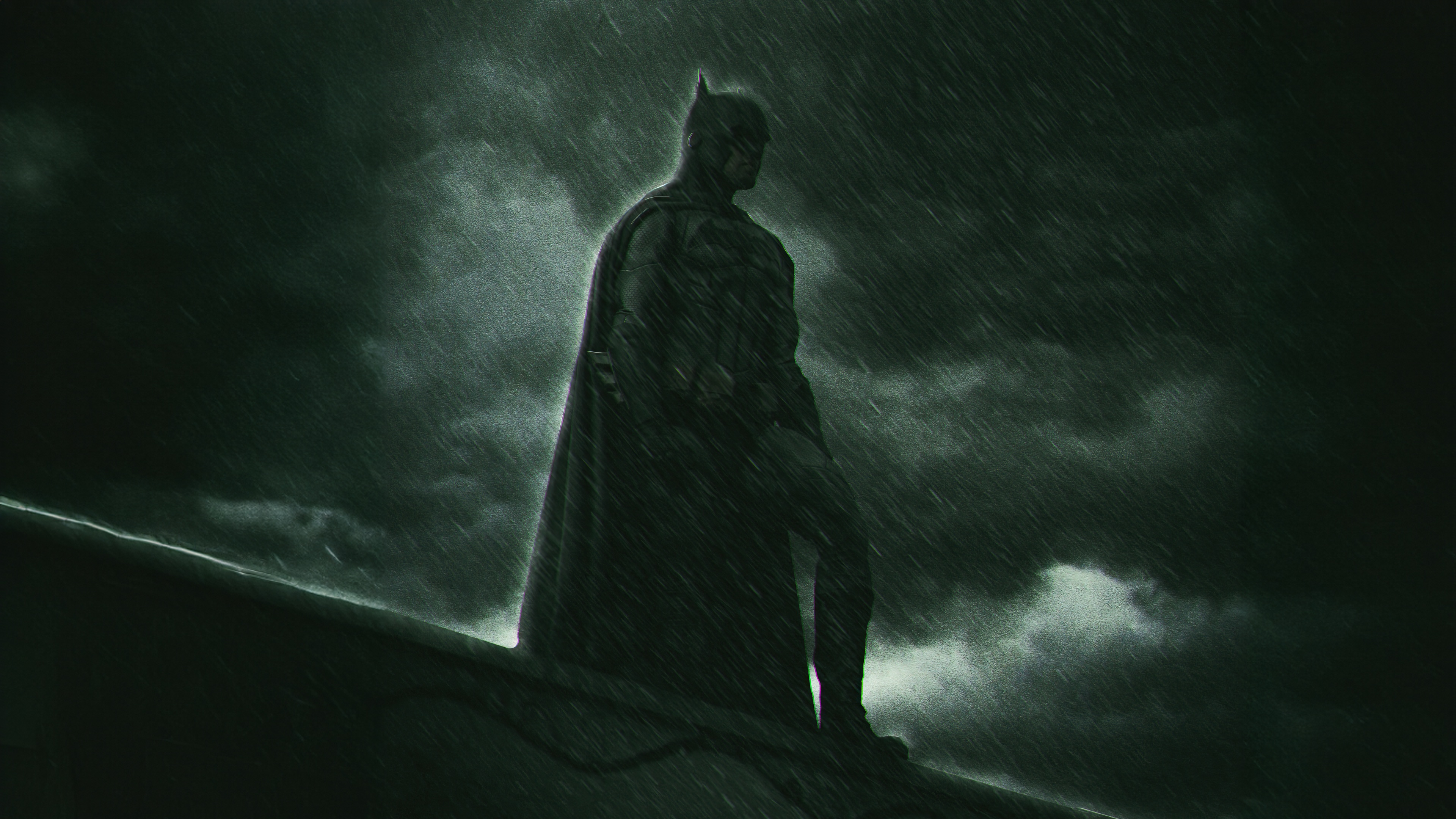 Batman Standing on a Rooftop in the Rain HD Wallpaper