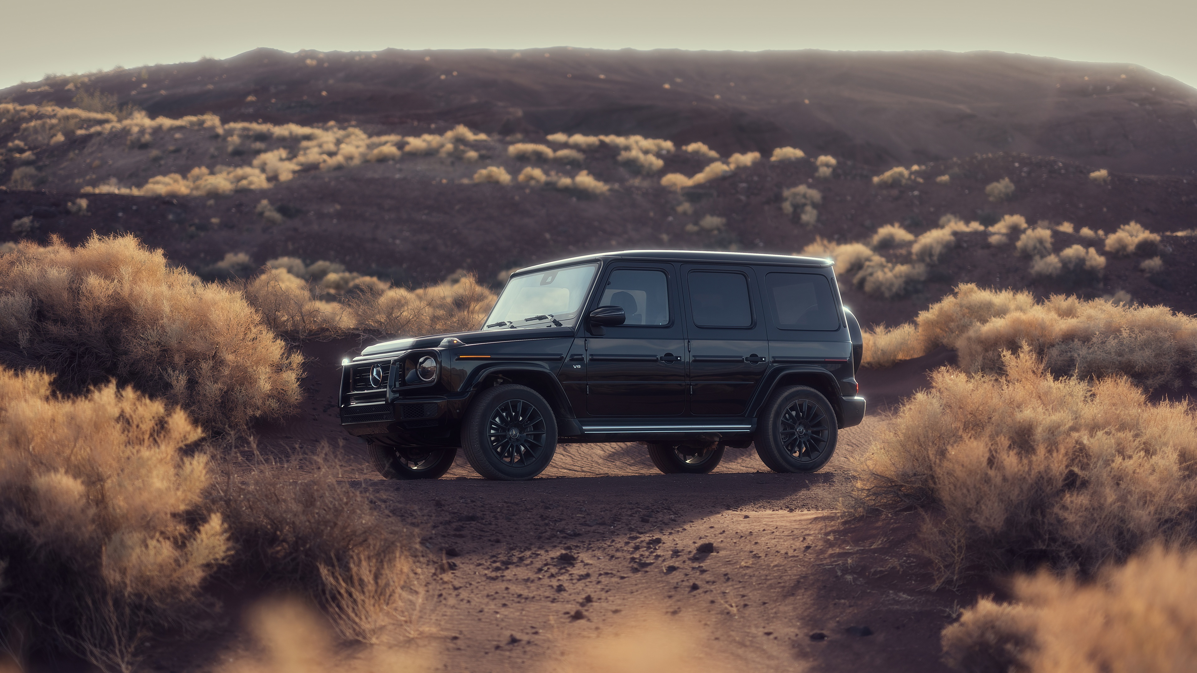 Black Mercedes G Wagon in a desert landscape HD Wallpaper