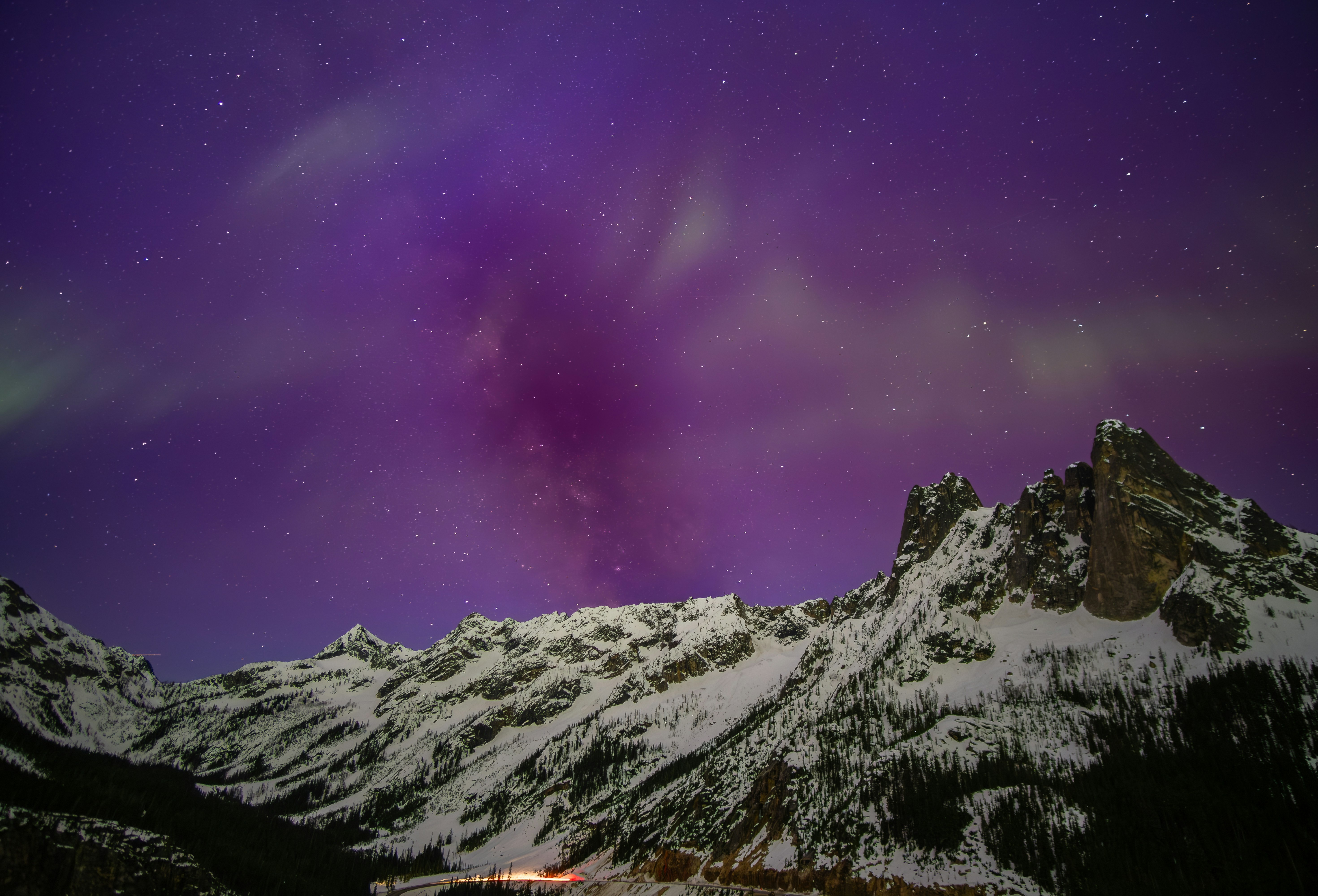 Aurora Borealis over snow-covered mountains HD Wallpaper