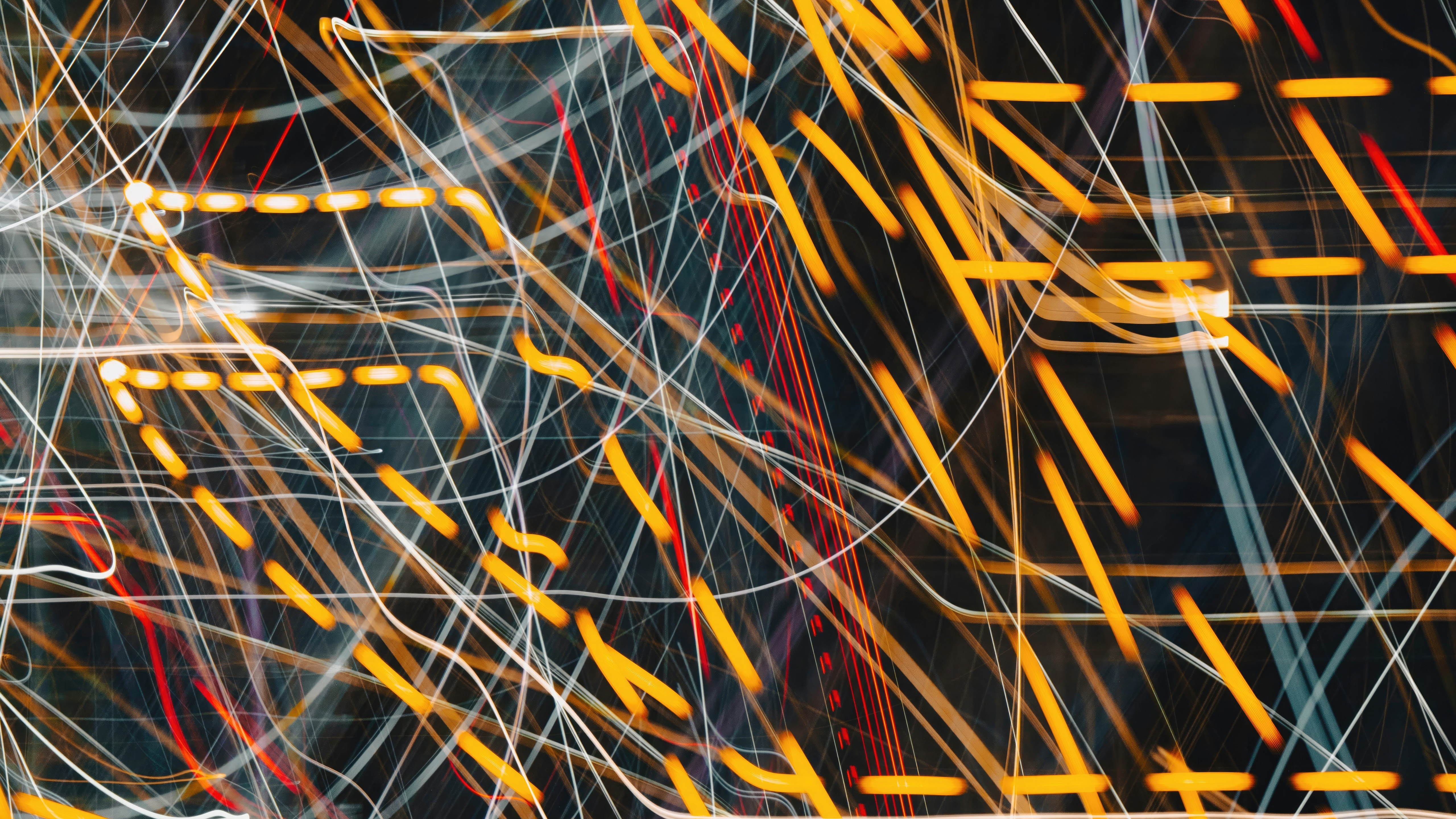Abstract light trails of yellow, white, and red lines HD Wallpaper