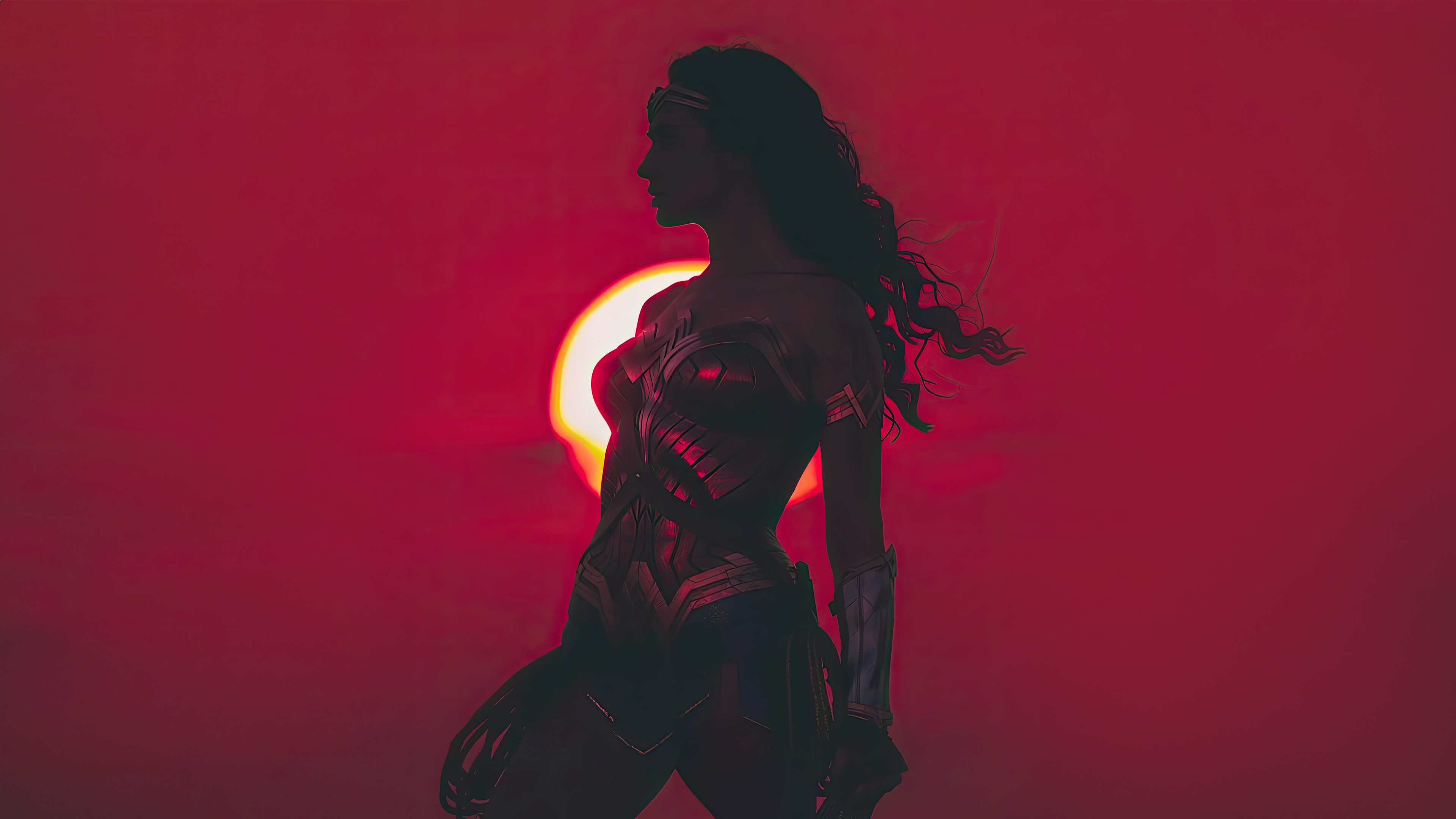 Wonder Woman silhouetted against a red sun HD Wallpaper