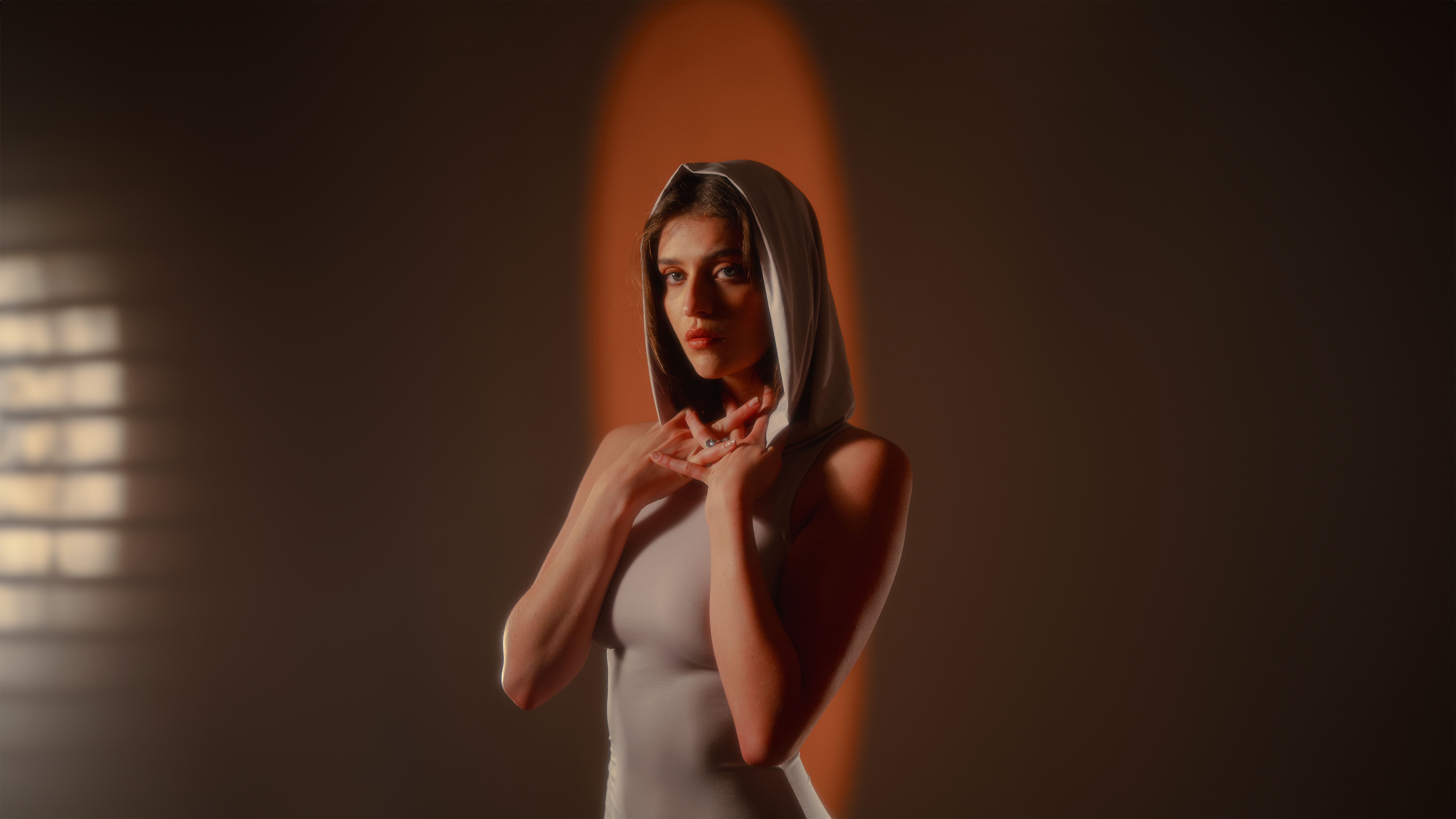Woman in a hooded dress with dramatic lighting HD Wallpaper
