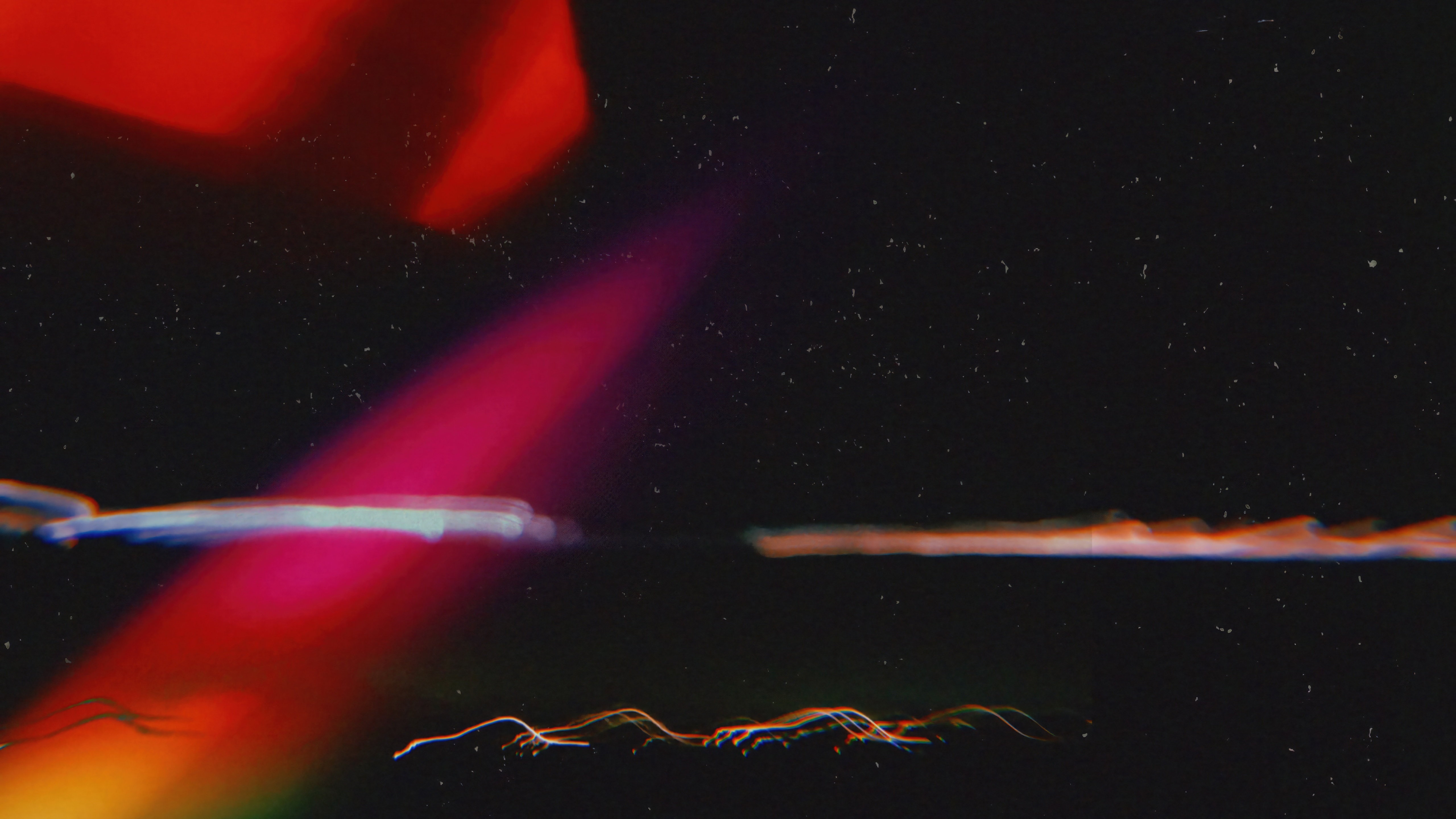 Filmy Grain Texture with Red and Pink Light Streaks HD Wallpaper