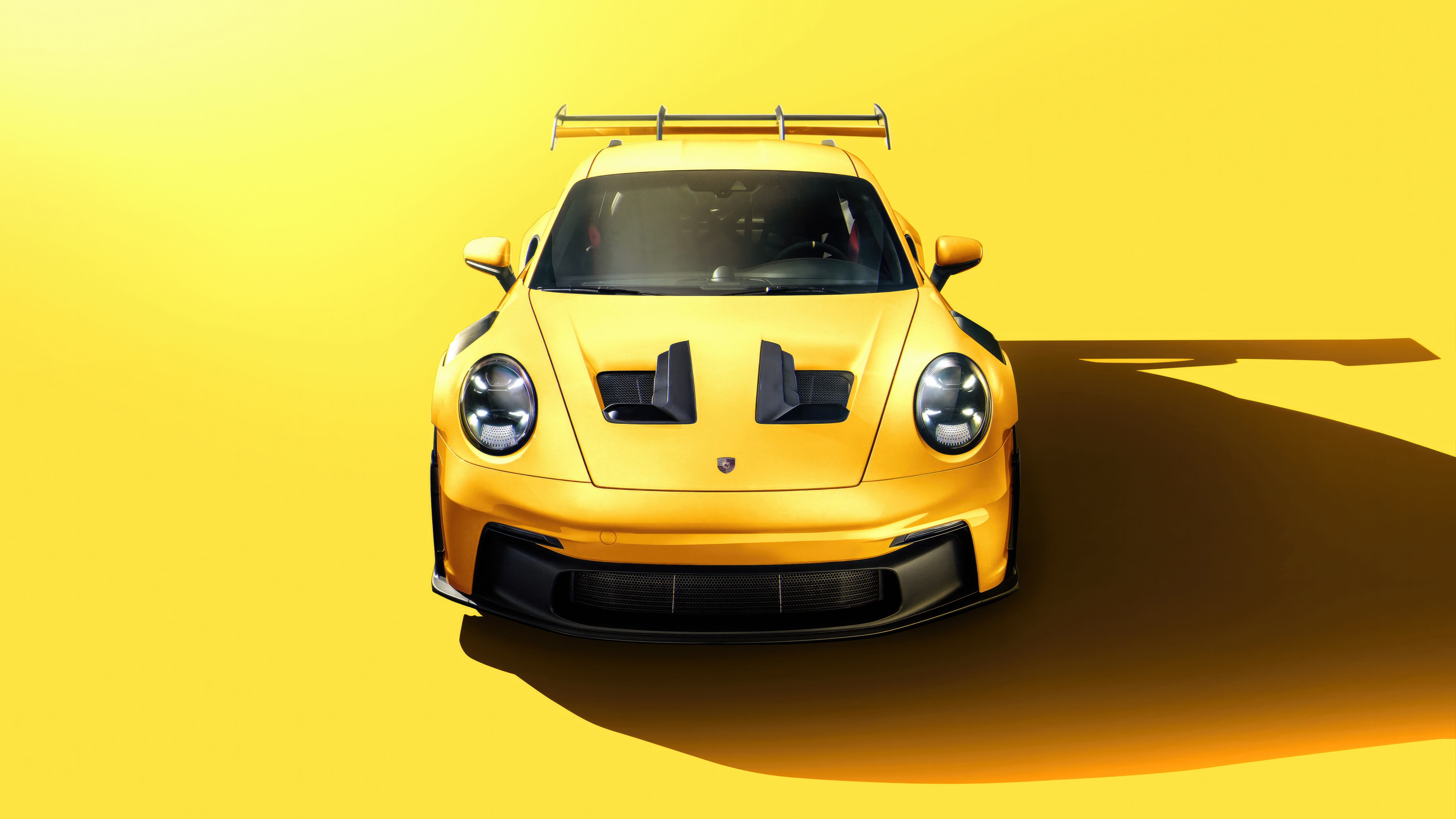 Yellow Porsche 911 GT3 RS on a yellow background HD Wallpaper