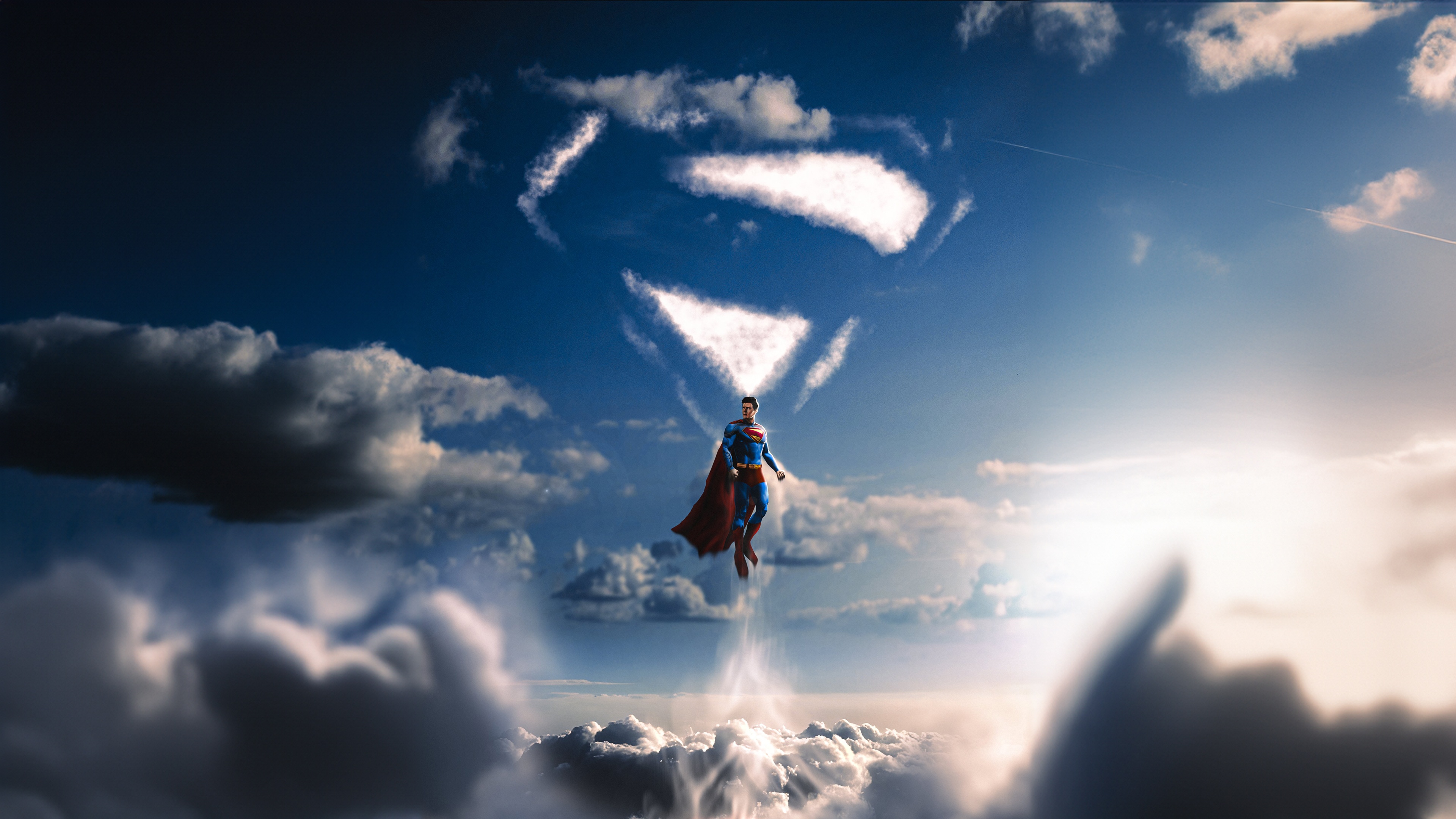 Superman flies through the sky with a cloud formation of his symbol HD Wallpaper