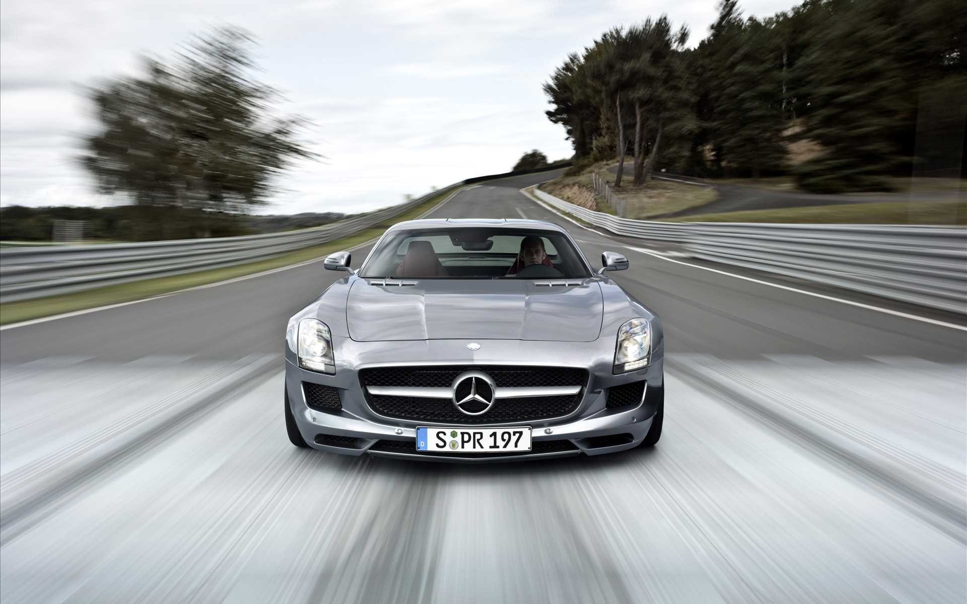 Mercedes-Benz SLS AMG driving on a race track HD Wallpaper
