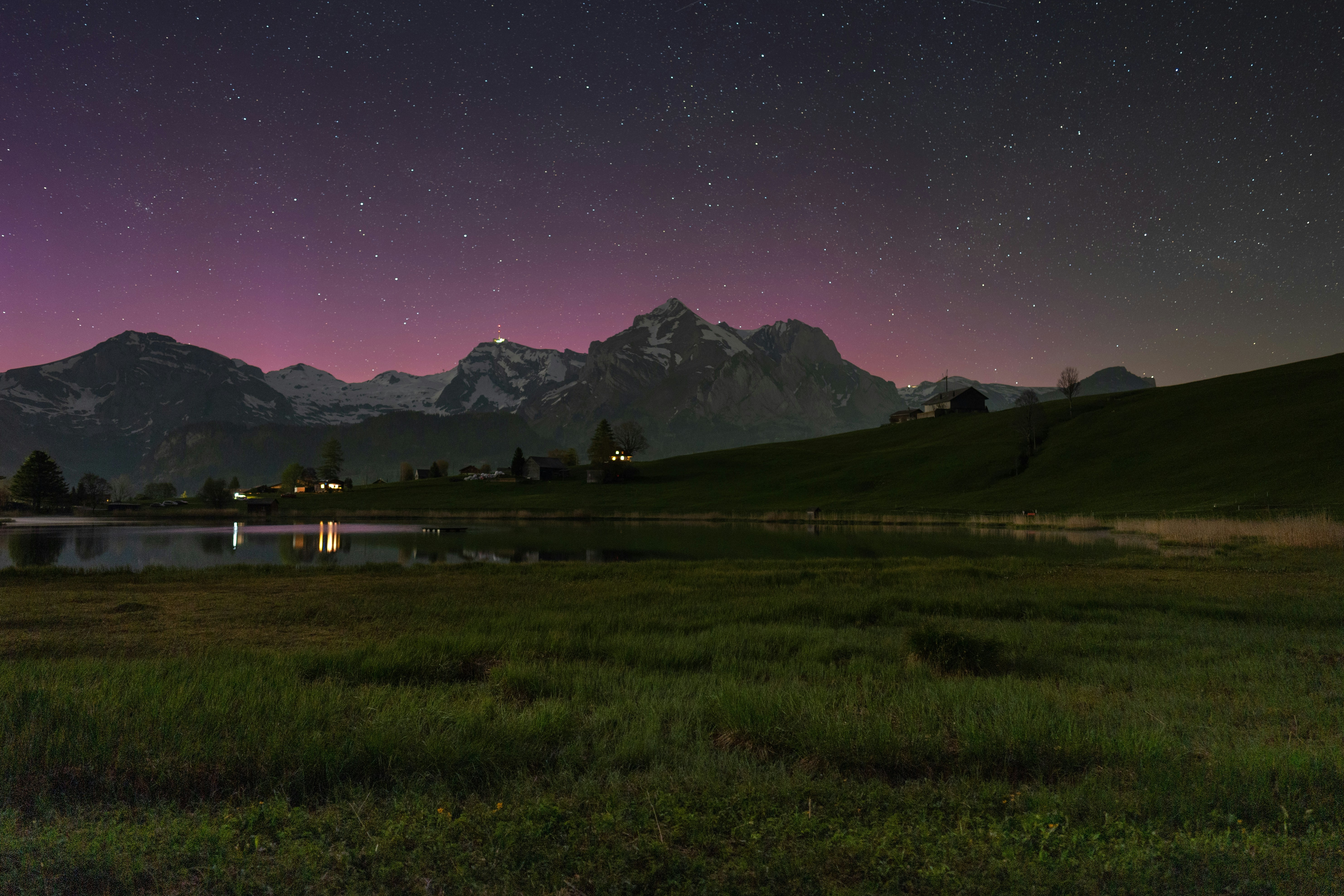 Mountain lake under a starry night sky HD Wallpaper
