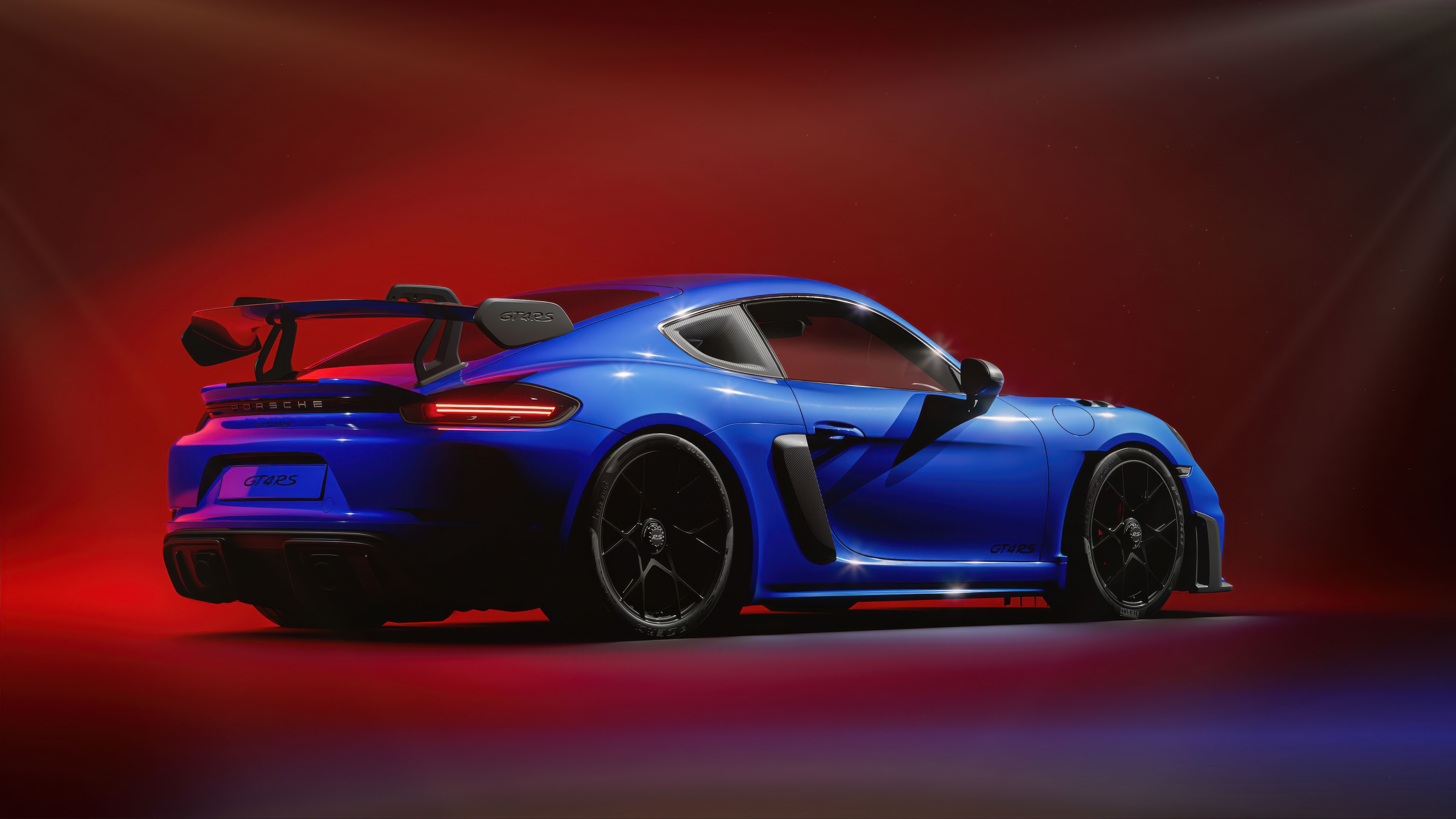 Blue Porsche GT4RS with a large rear spoiler HD Wallpaper