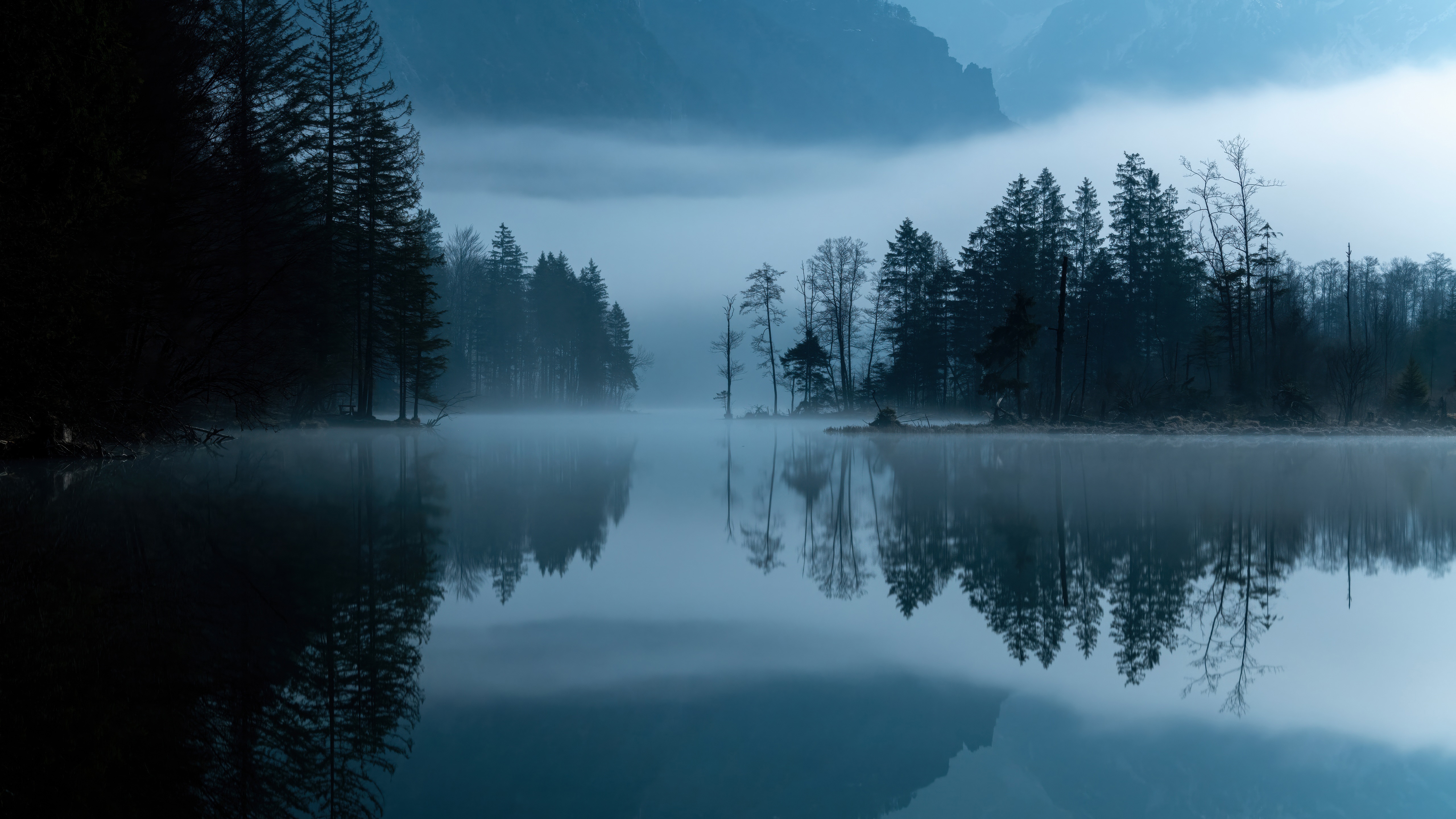 Misty lake with forest and mountain reflections HD Wallpaper