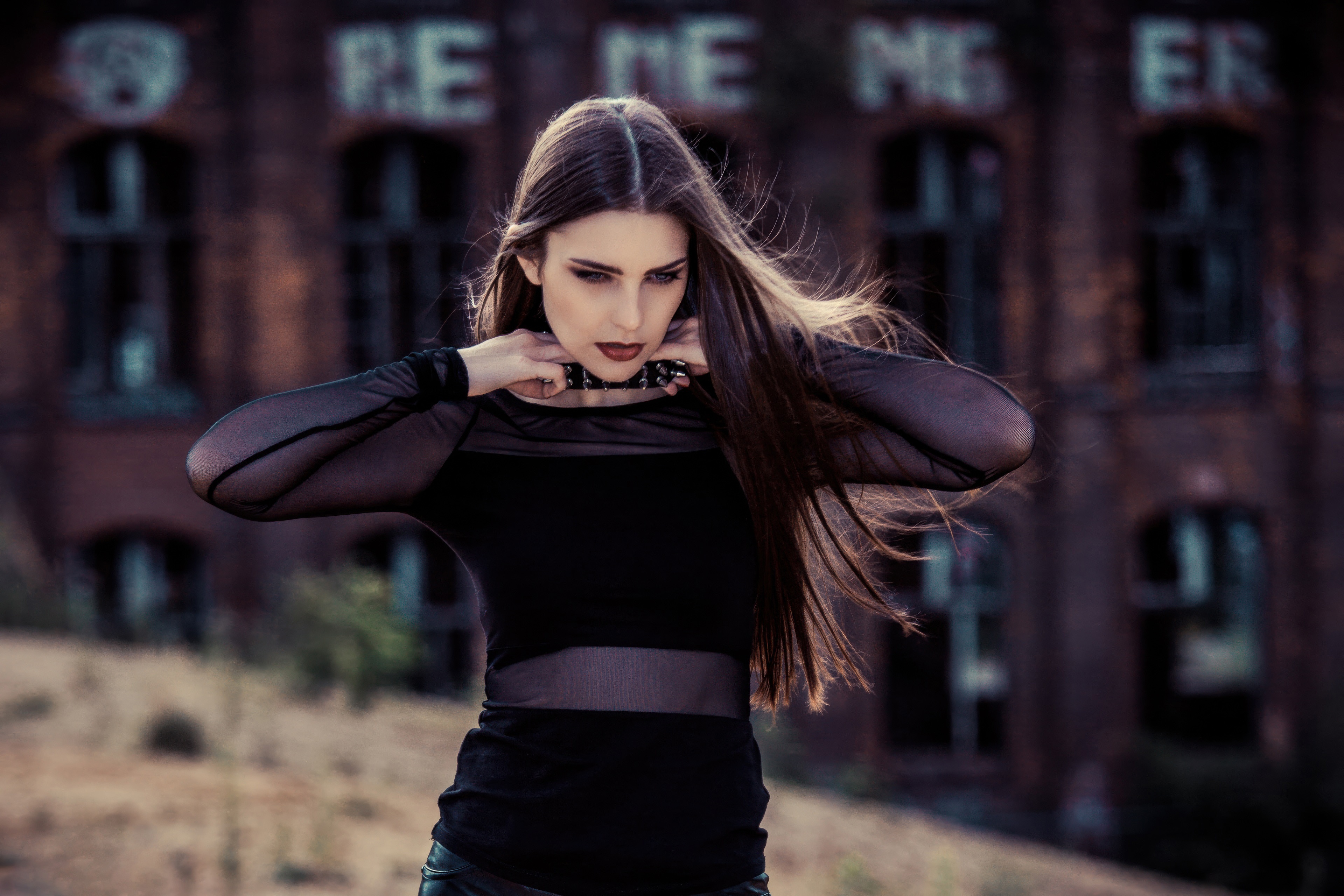 Girl in black clothing adjusting her hair HD Wallpaper