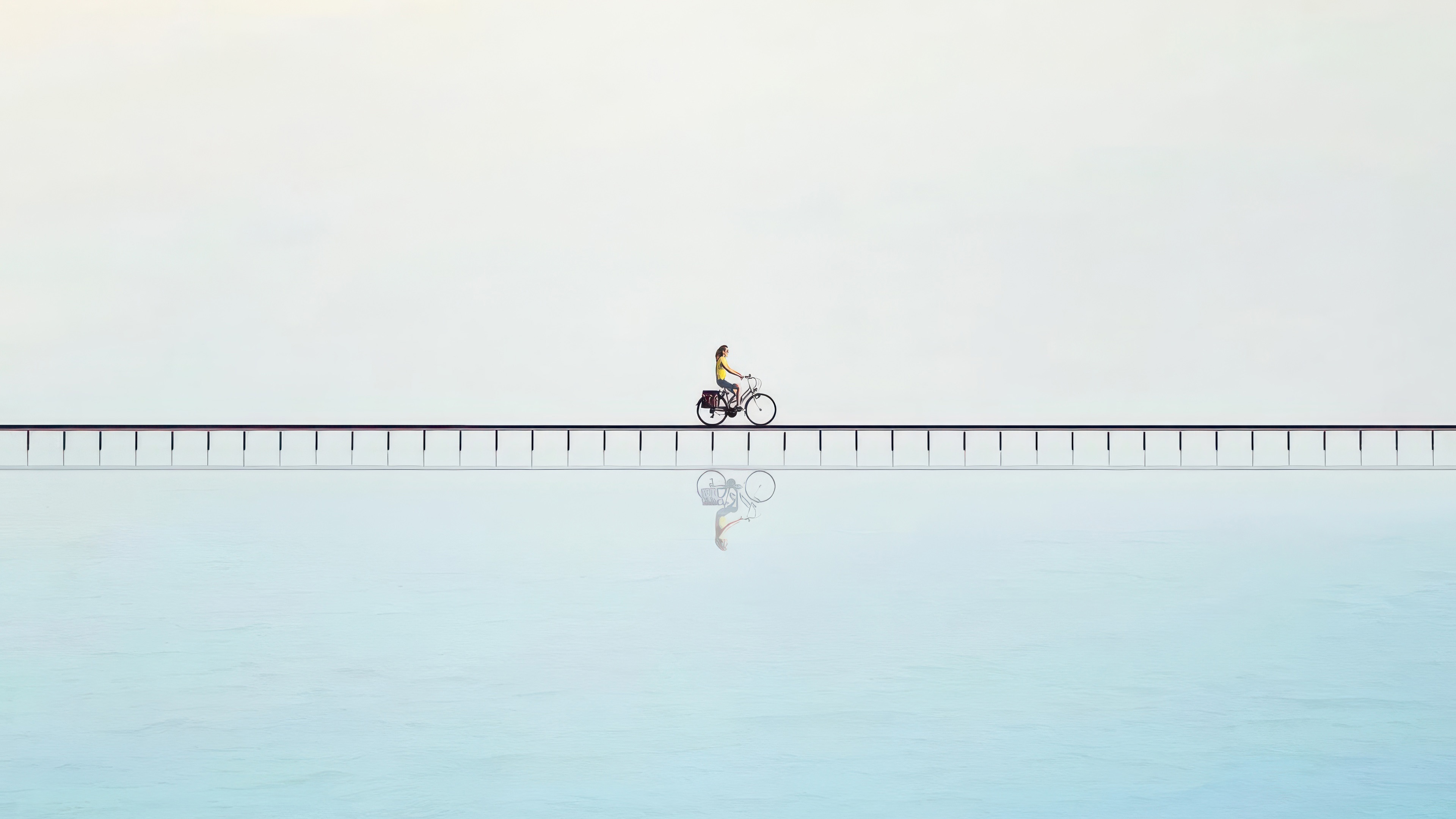 Person riding a bicycle on a bridge over water HD Wallpaper