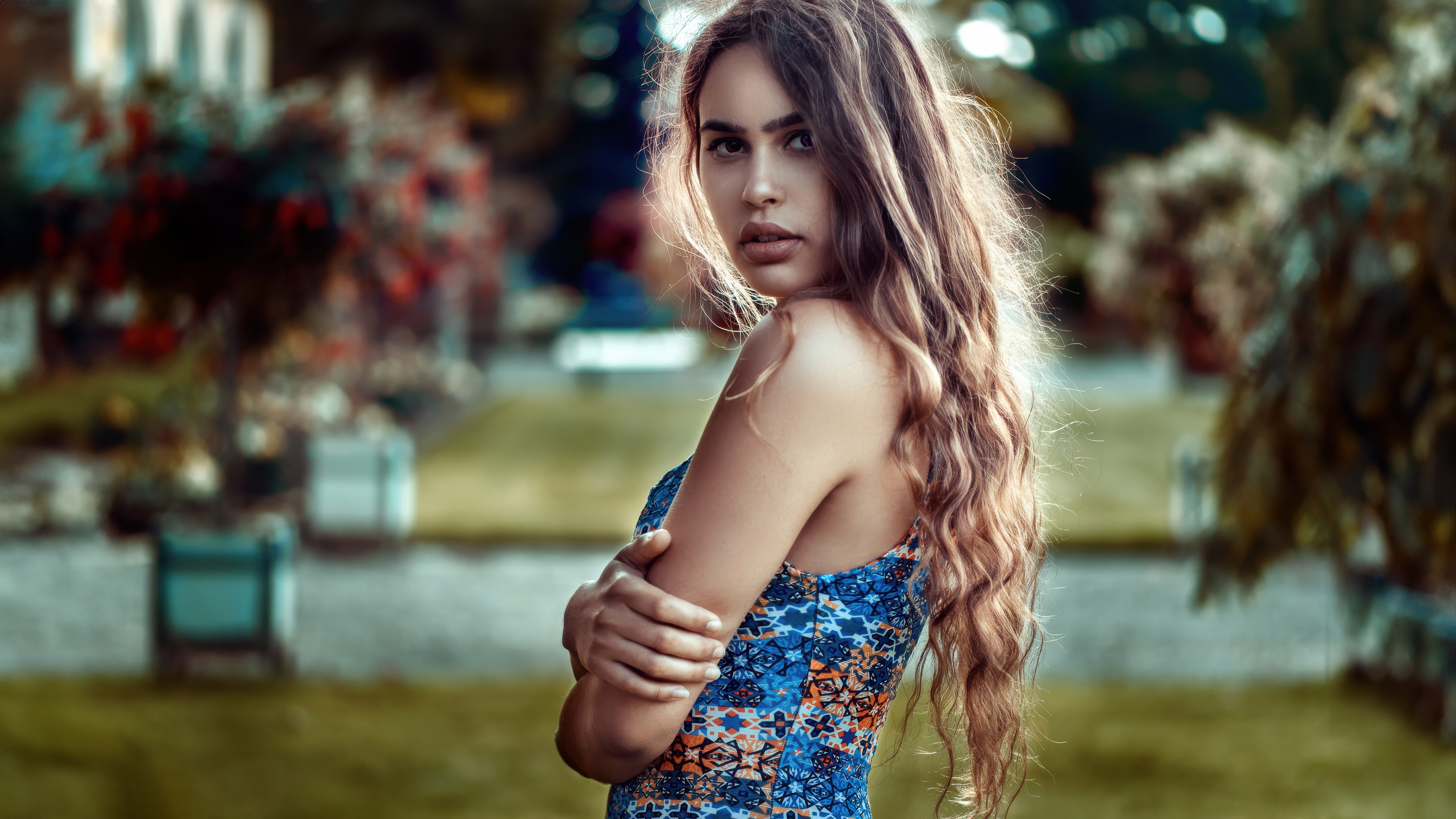 Girl with arms crossed and flowing hair HD Wallpaper