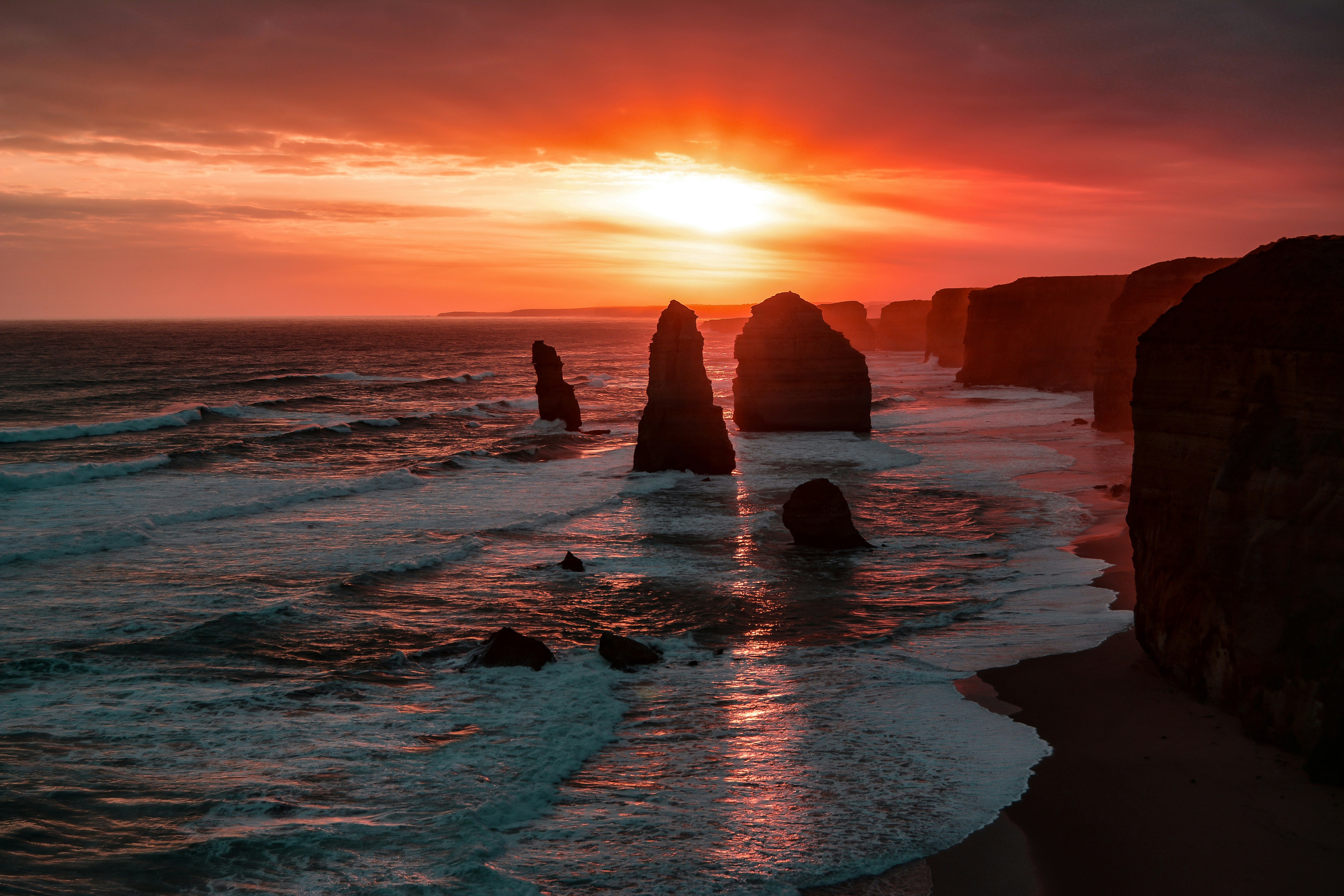 Sunset over the Twelve Apostles rock formations HD Wallpaper