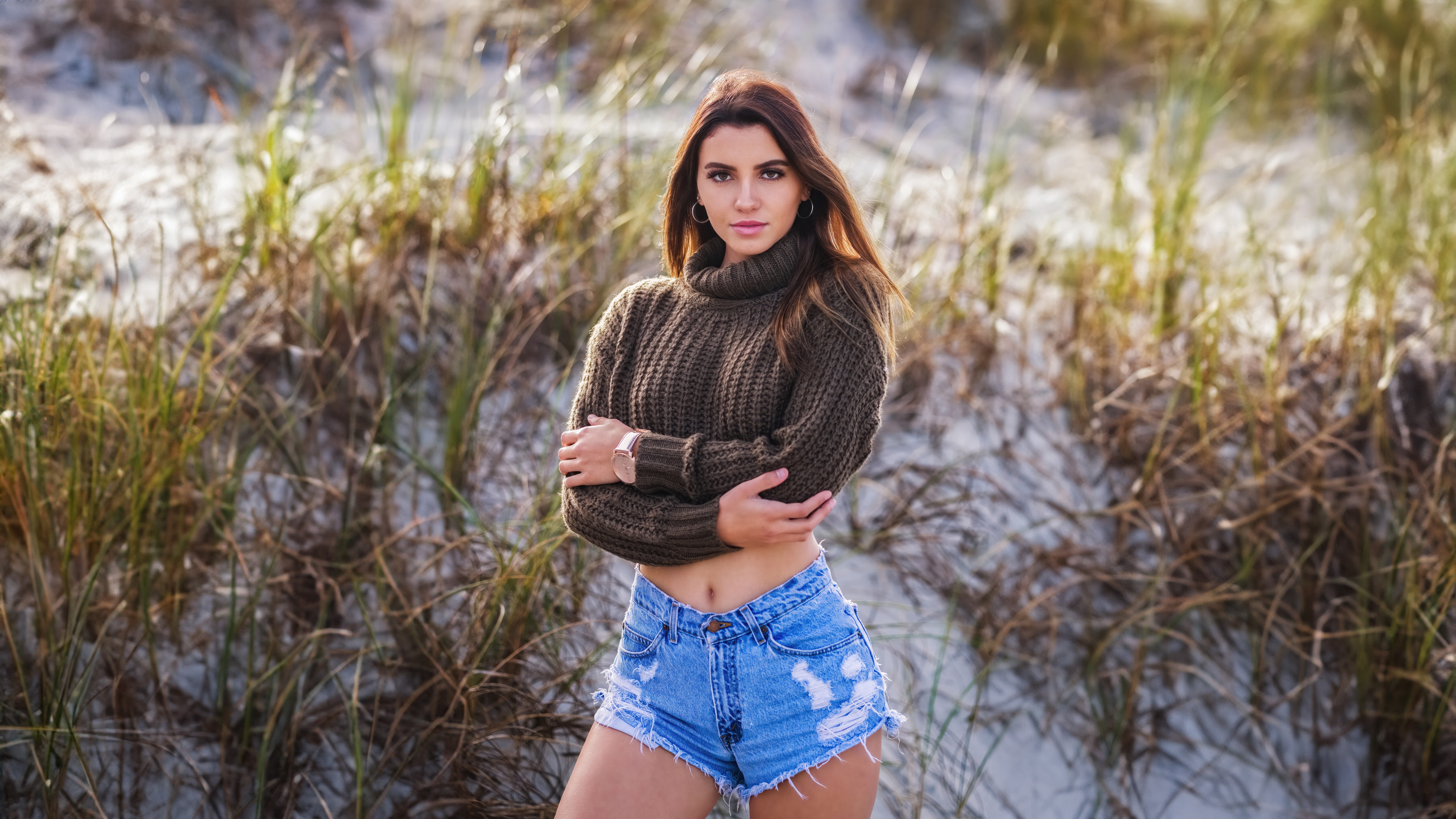 Brunette girl in a sweater and denim shorts HD Wallpaper