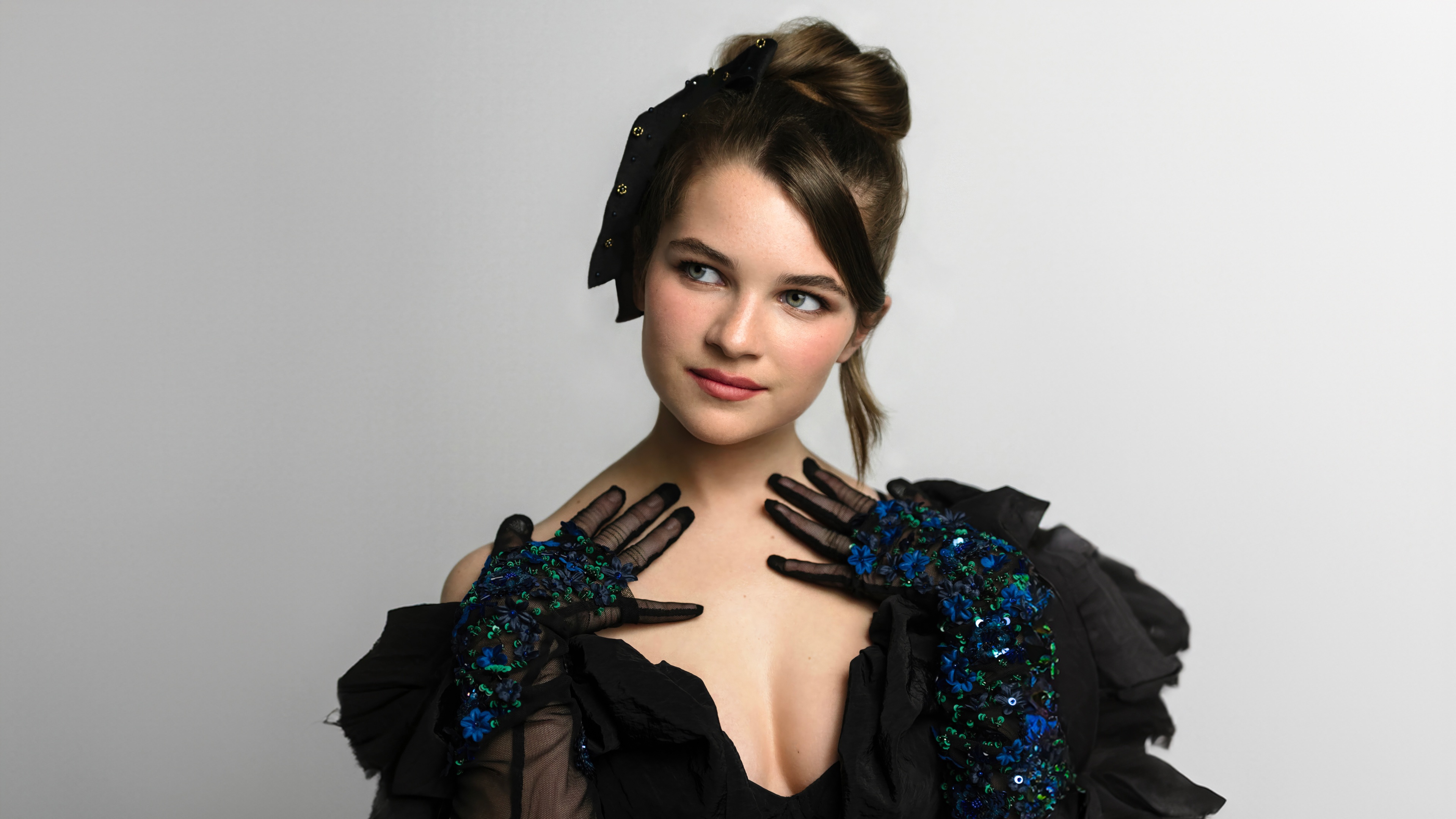Raegan Revord in a black dress and gloves HD Wallpaper