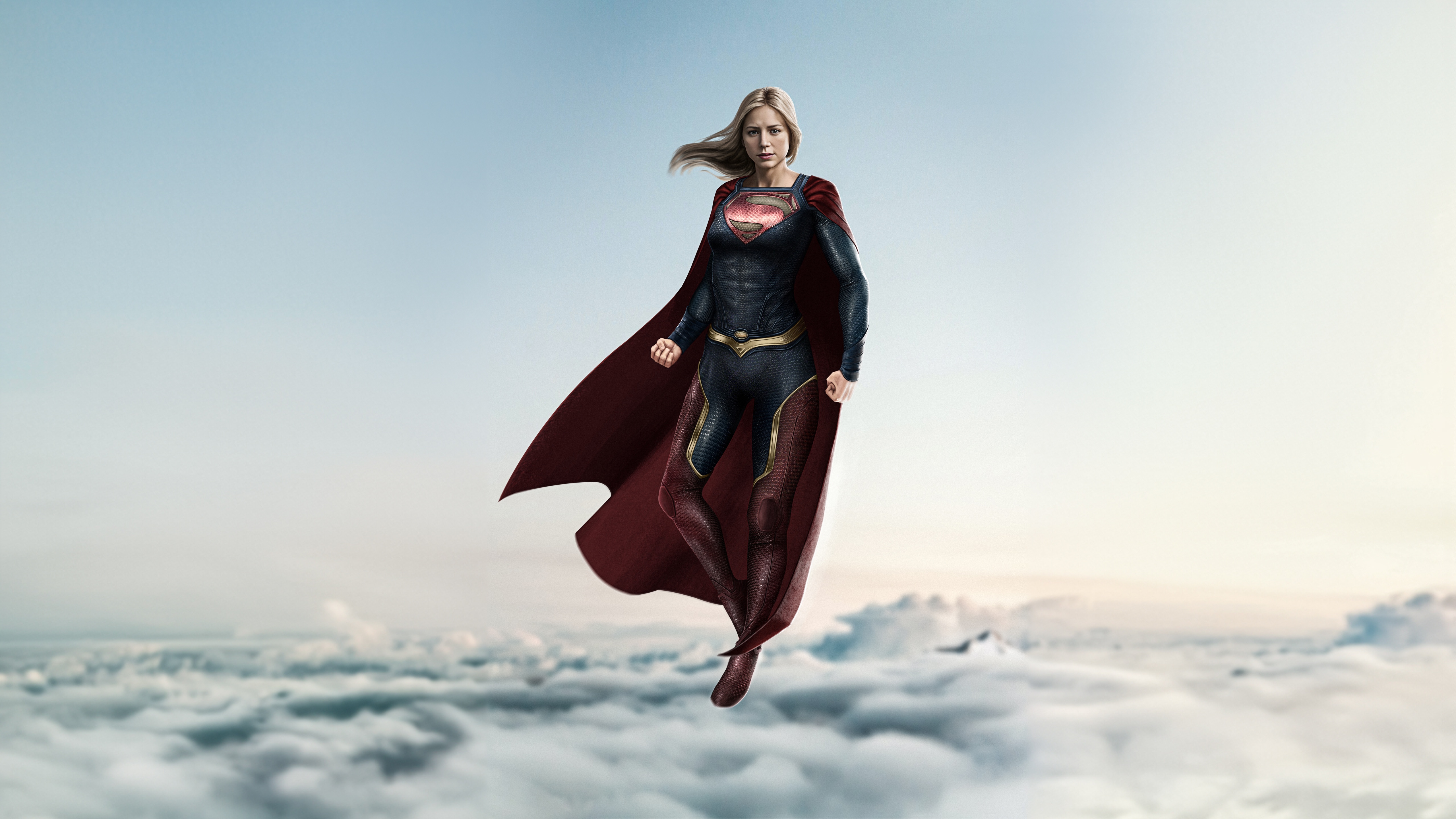 Supergirl flying above the clouds HD Wallpaper