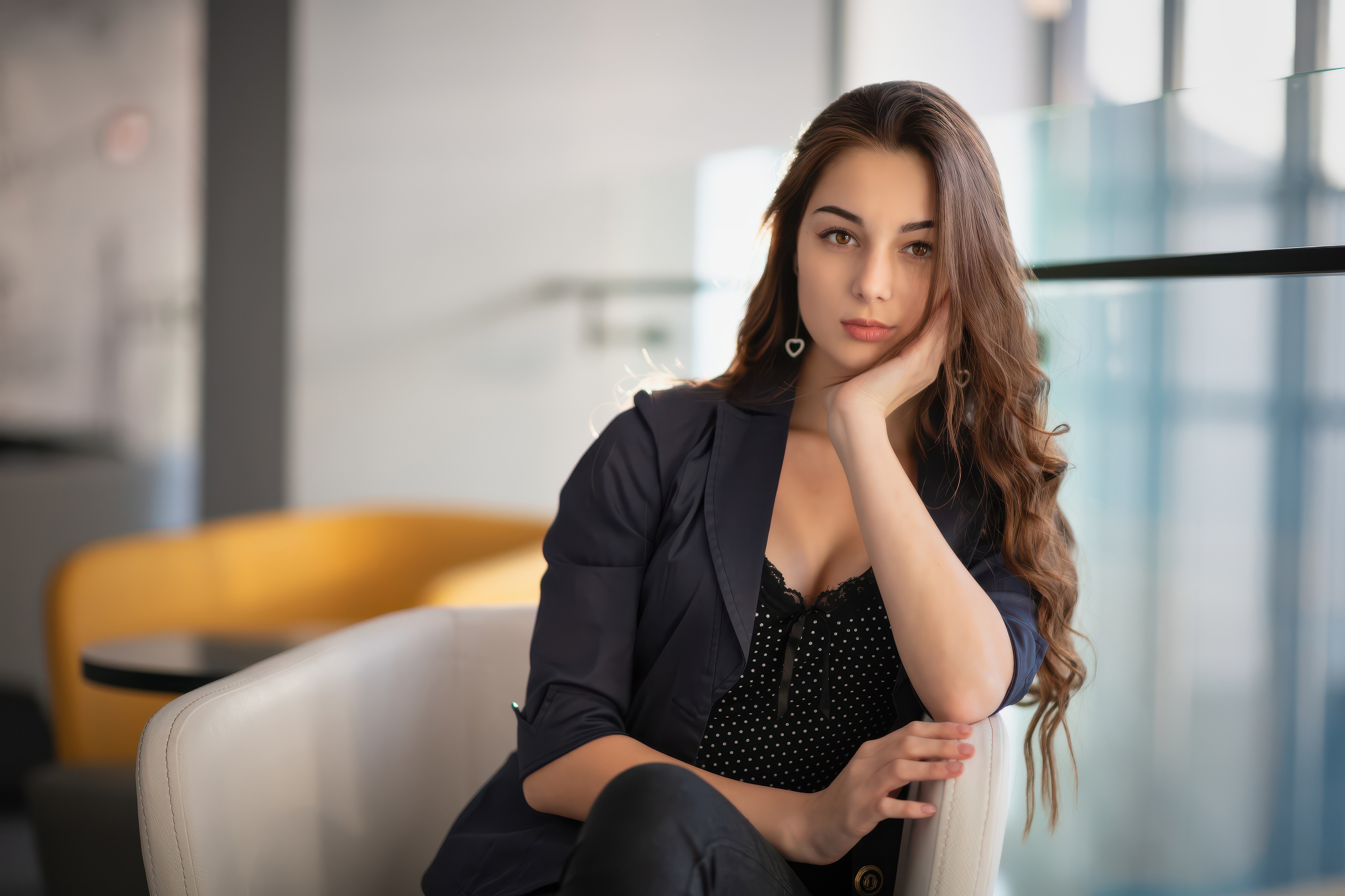 Woman in a blazer sitting in a chair HD Wallpaper