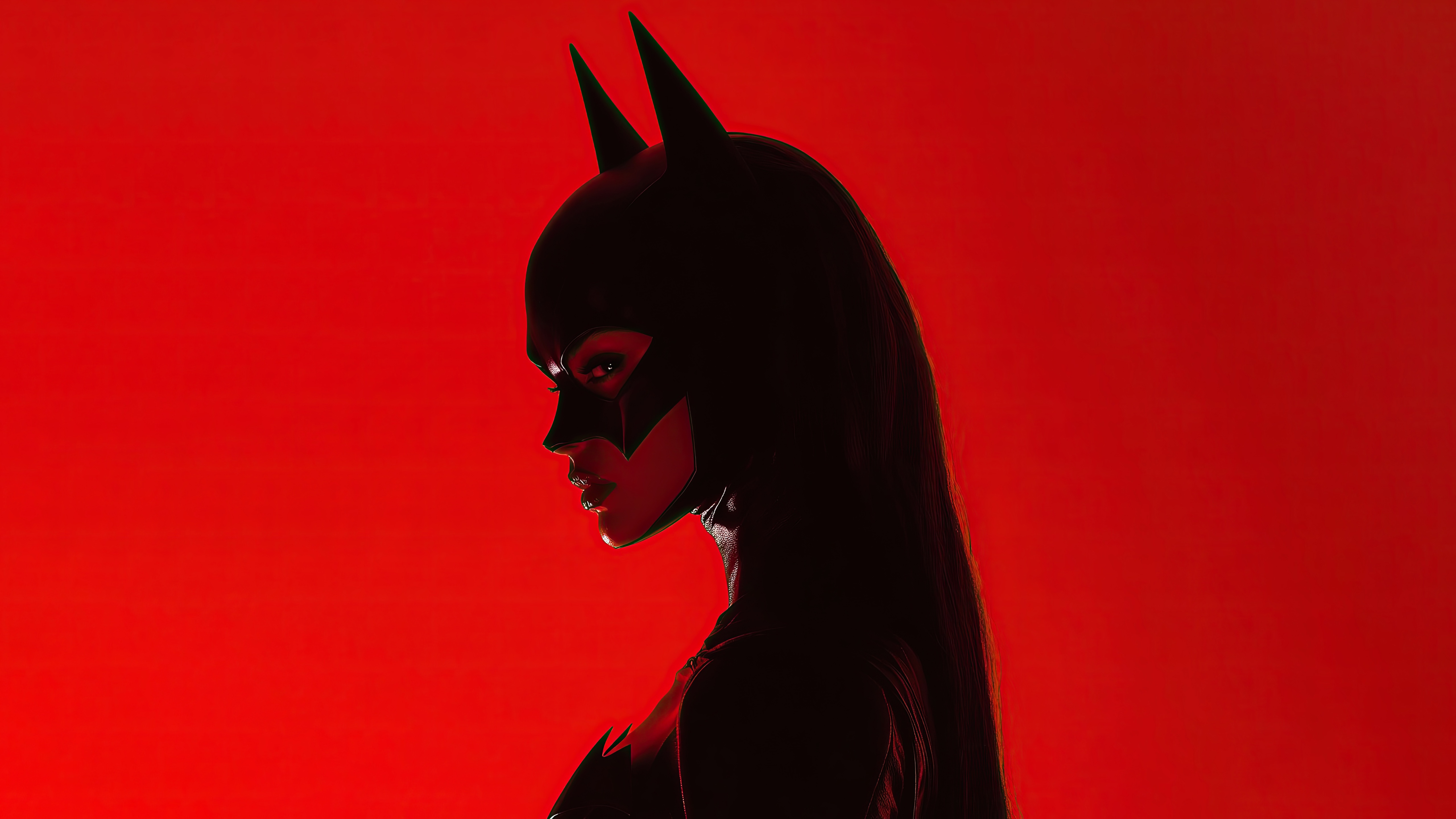 Batwoman in silhouette against a red background HD Wallpaper